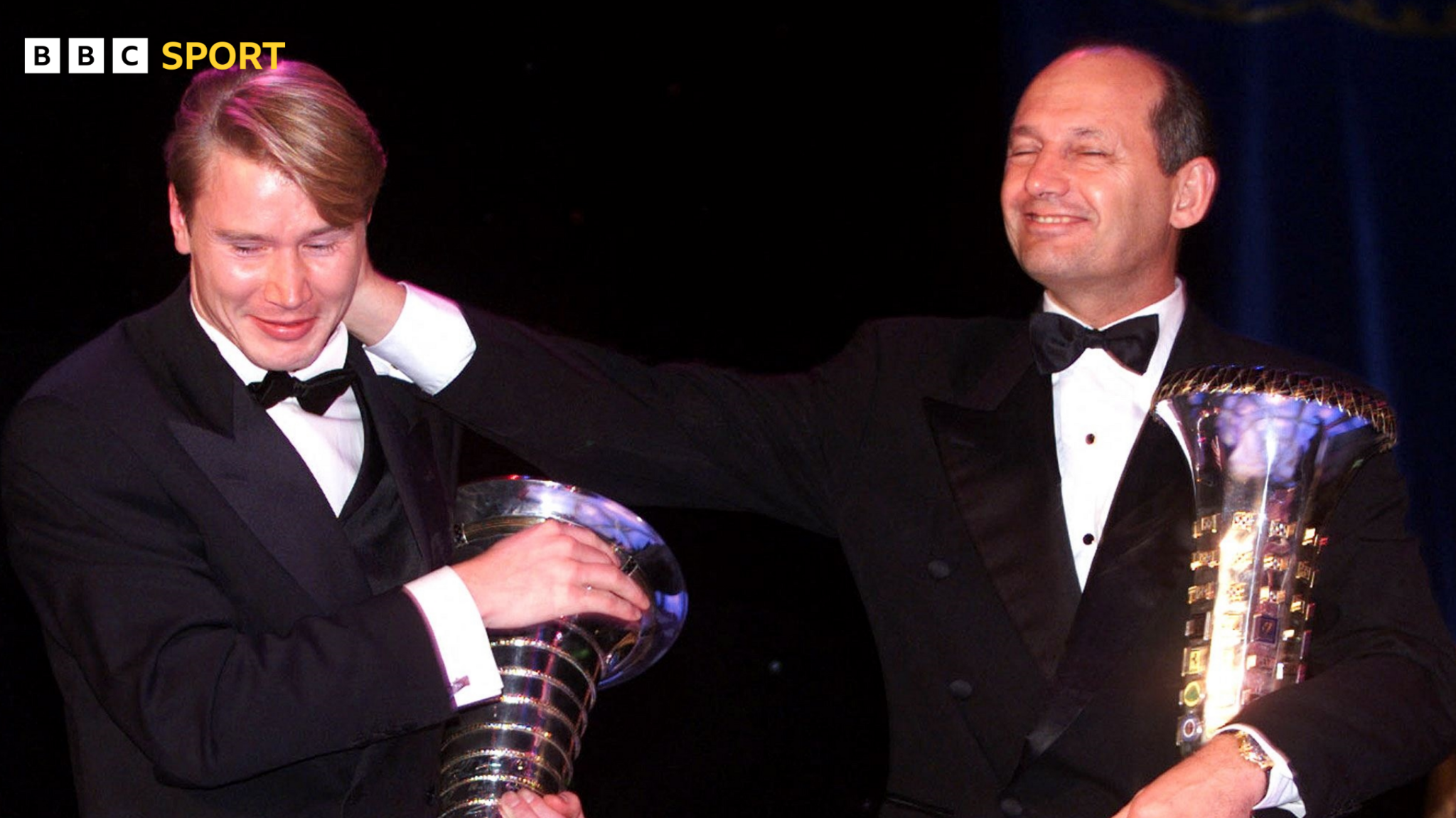 Mika Hakkinen (left) and then team boss Ron Dennis with the drivers' and constructors' championship trophies when McLaren last won the team title in 1998