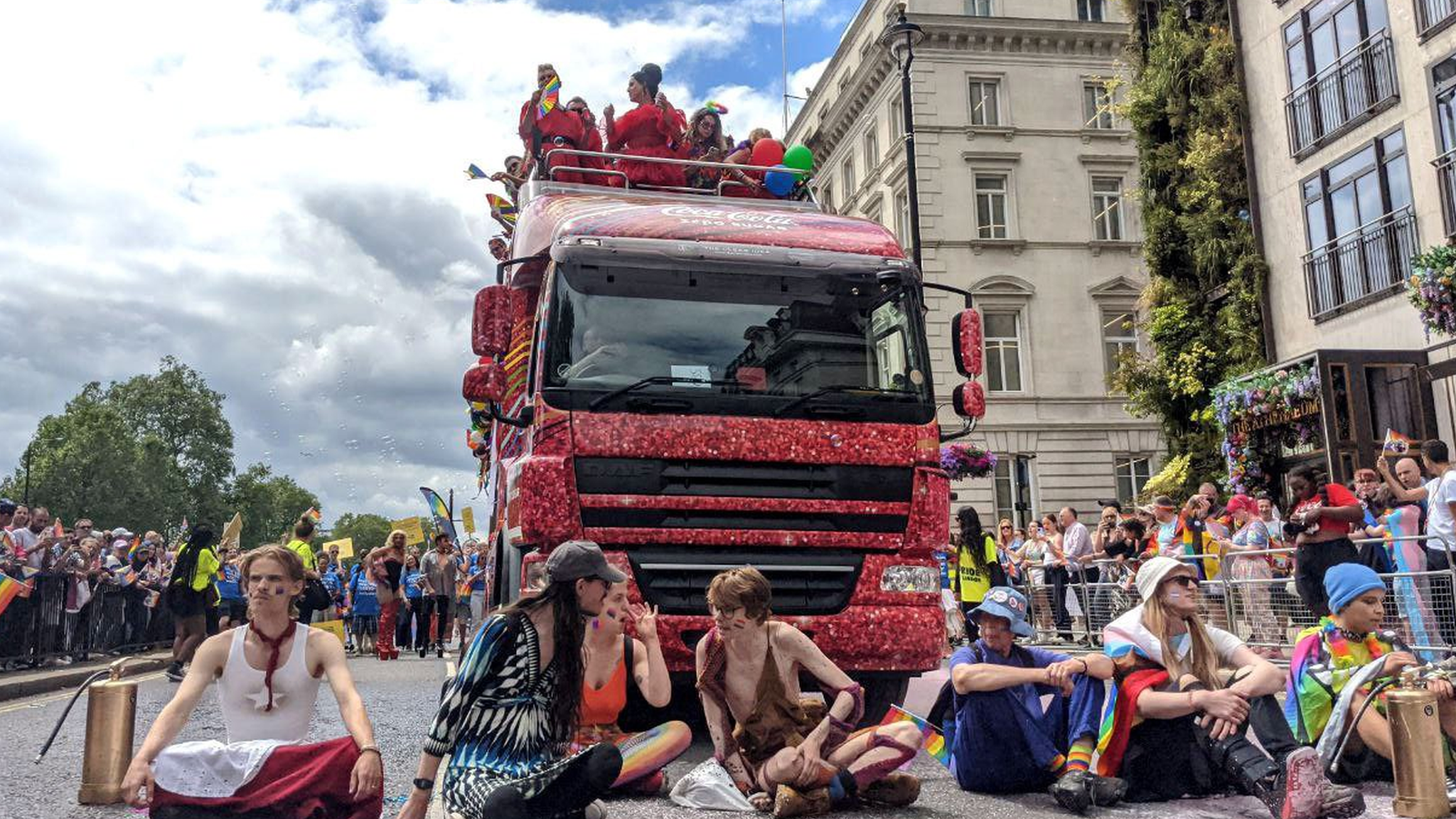 Just Stop Oil protesters briefly halted the parade after sitting down in front of a float at Piccadilly's junction with Down Street