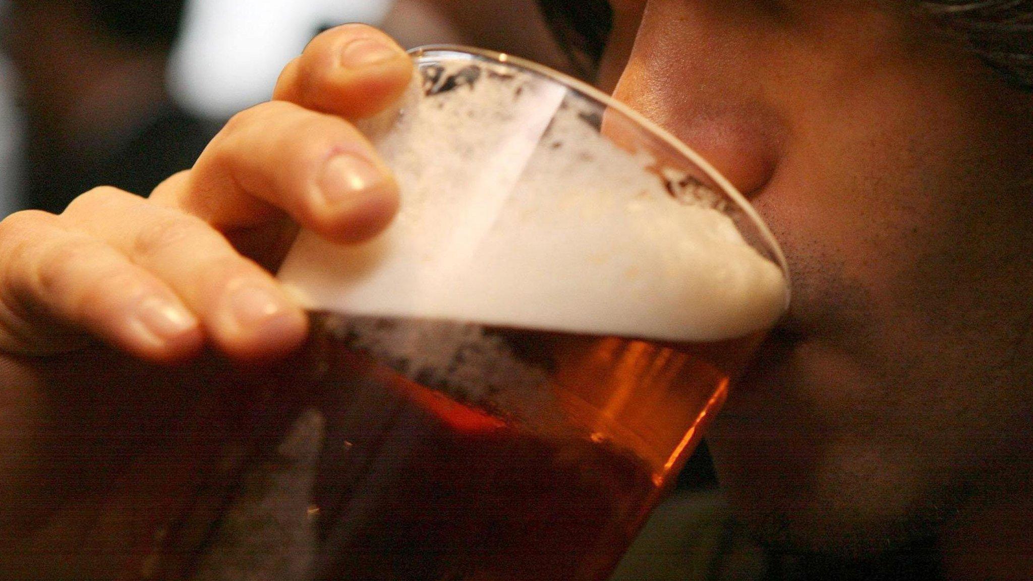 Man drinking beer from a glass