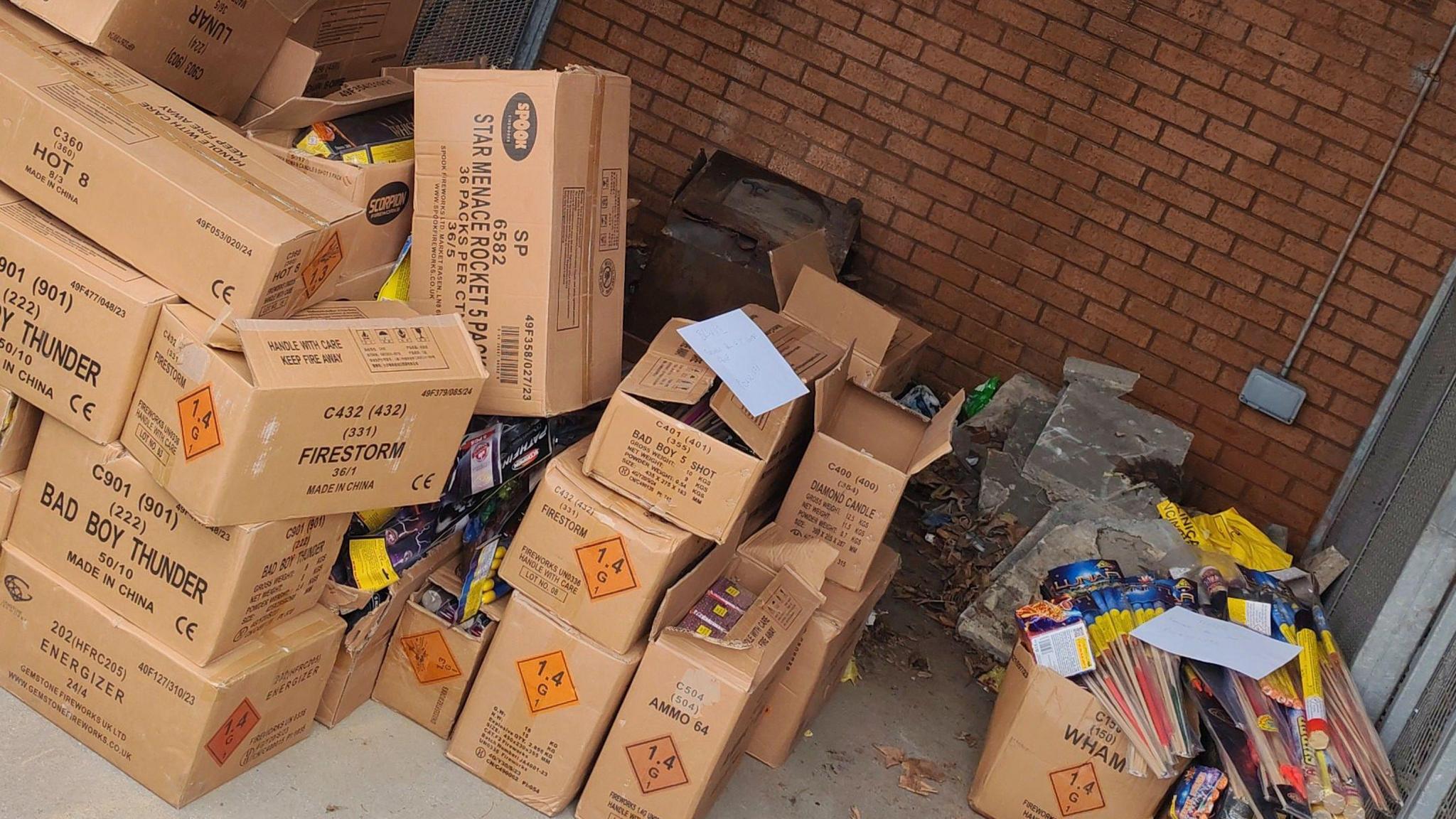 Fireworks stored in cardboard boxes in a garage 