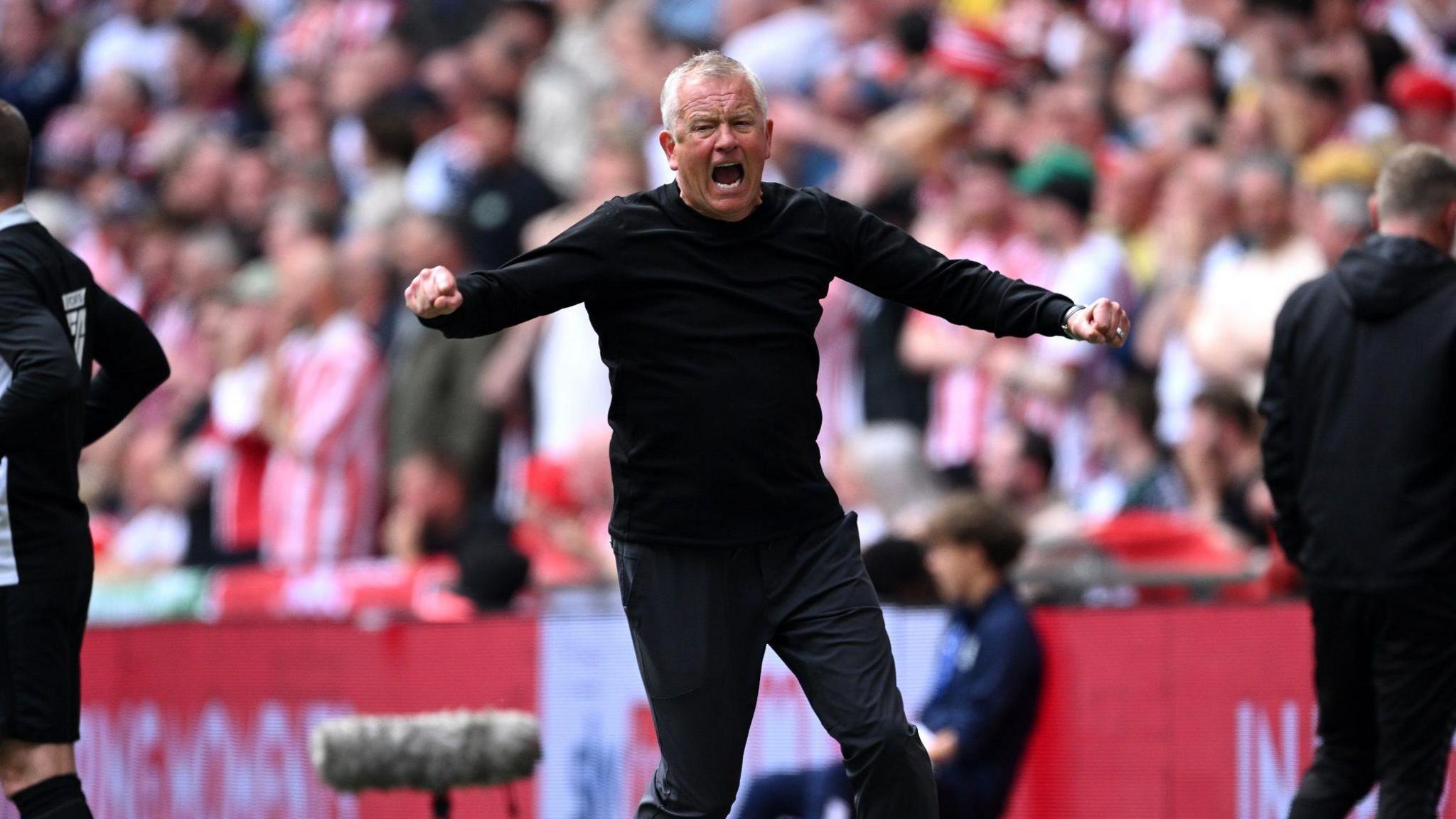 Chris Wilder celebrates Sheffield United scoring in their Championship play-off final against Sunderland