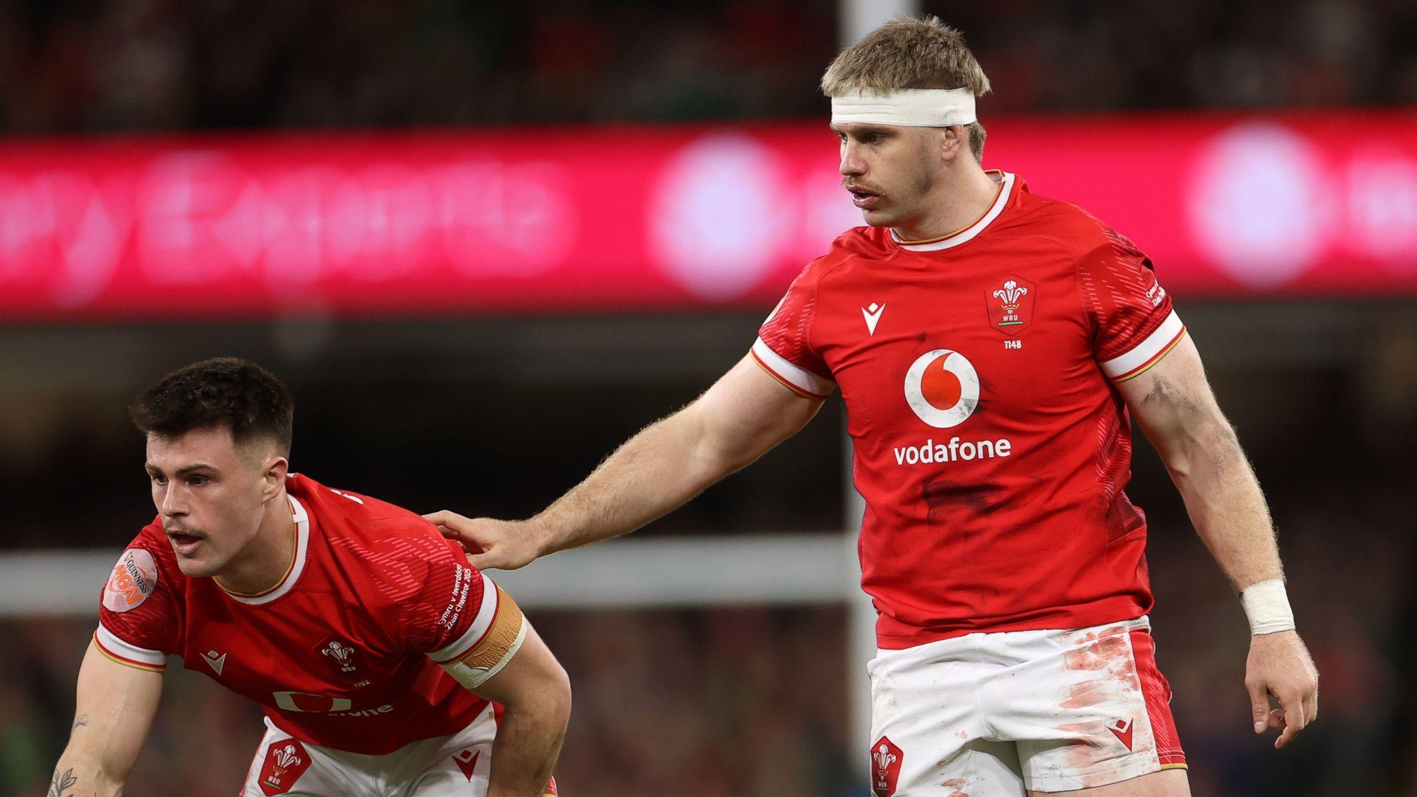 Aaron Wainwright (right) with hand on Wales team-mate Joe Roberts during the Six Nations game against Ireland