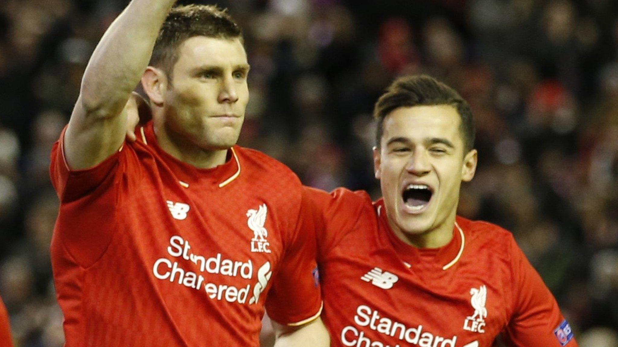 James Milner celebrates with Liverpool team-mate Philippe Coutinho