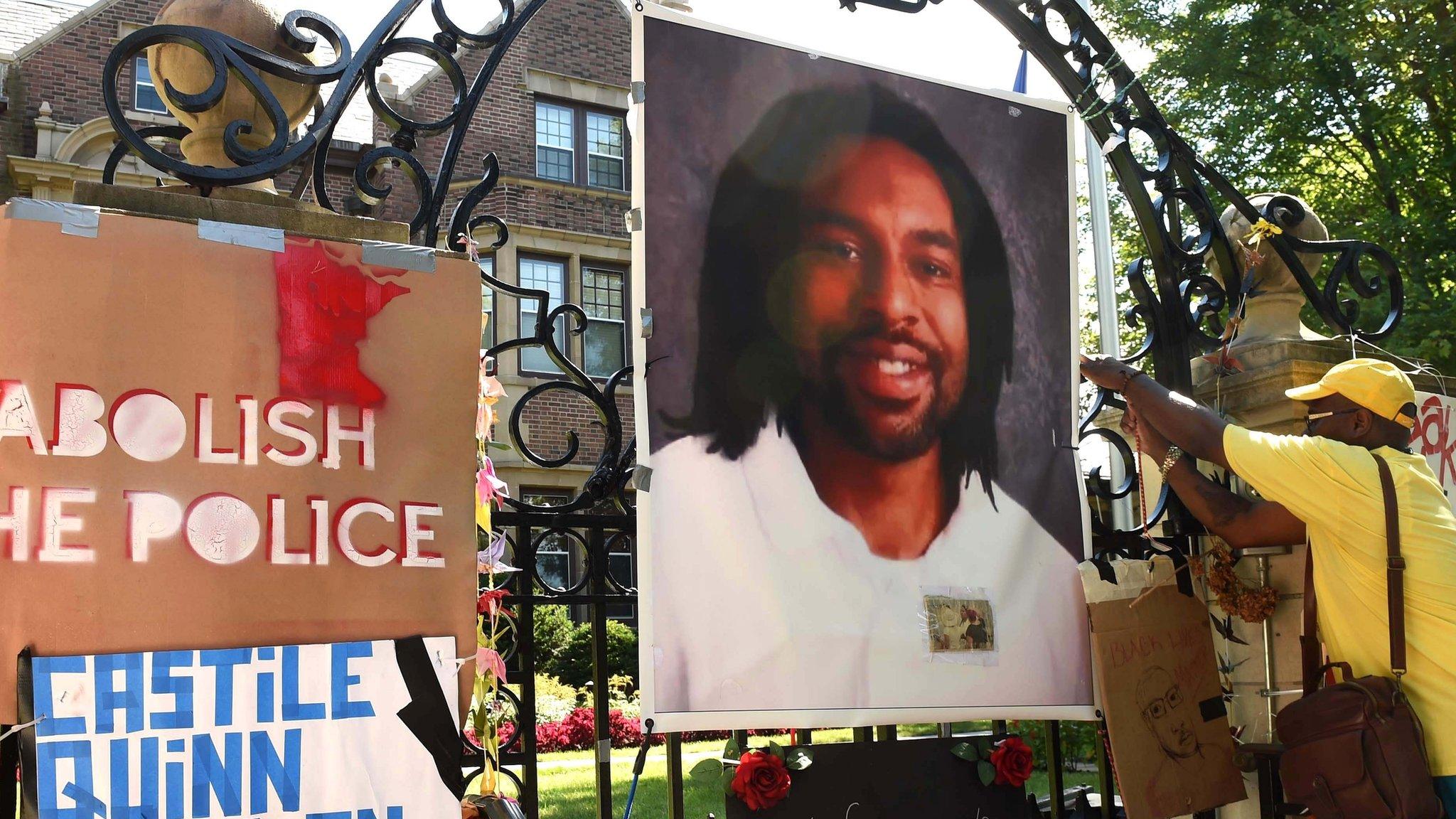 Protesters hang image of Philando Castile on gates of governor's residence in St Paul, Minnesota. 24 July 2016