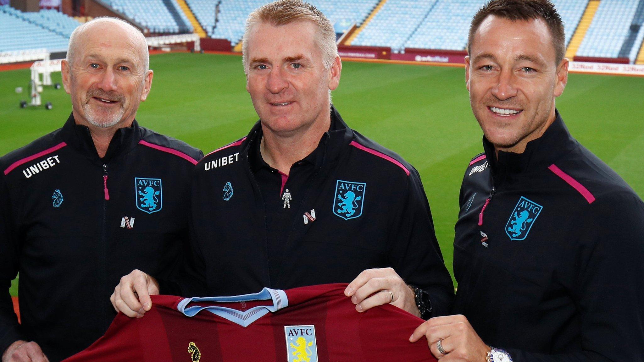 Dean Smith (centre), with assistant head coaches John Terry (right) and Richard O'Kelly (left)