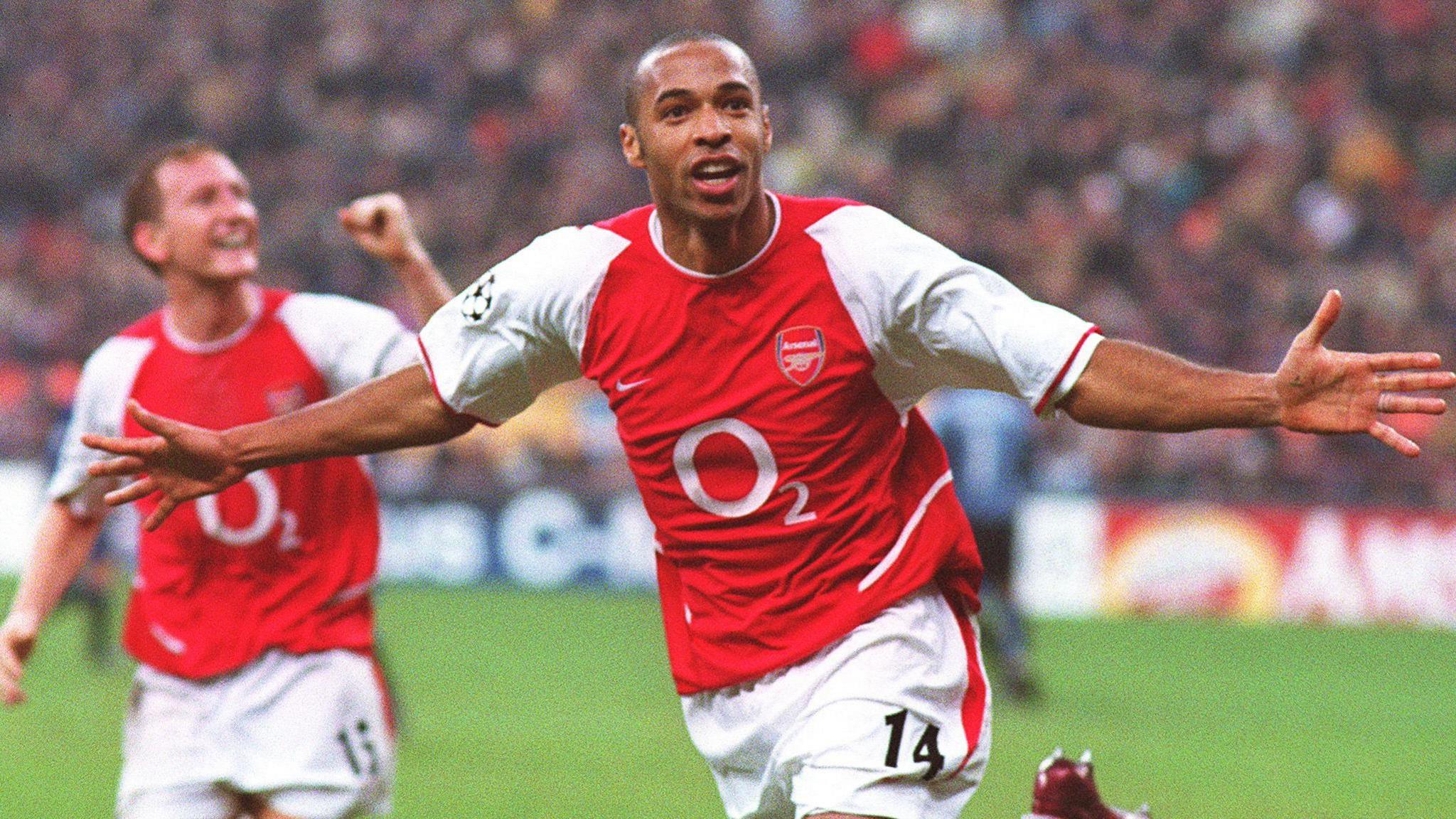 Arsenal's Thierry Henry celebrates with his arms held out