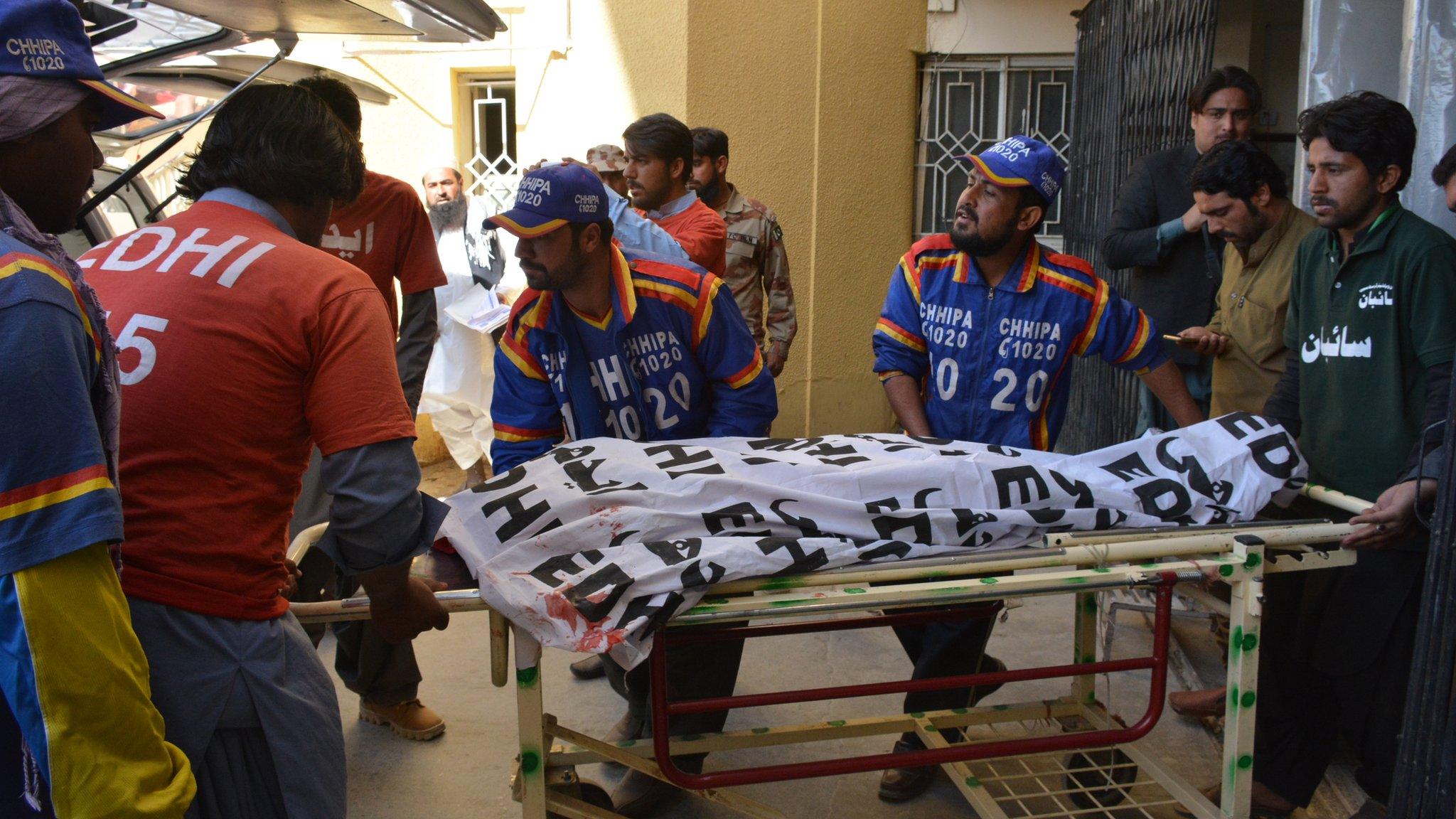 Pakistani volunteers transport the body of a polio worker from a hospital following an attack by gunmen in Quetta on January 18, 2018