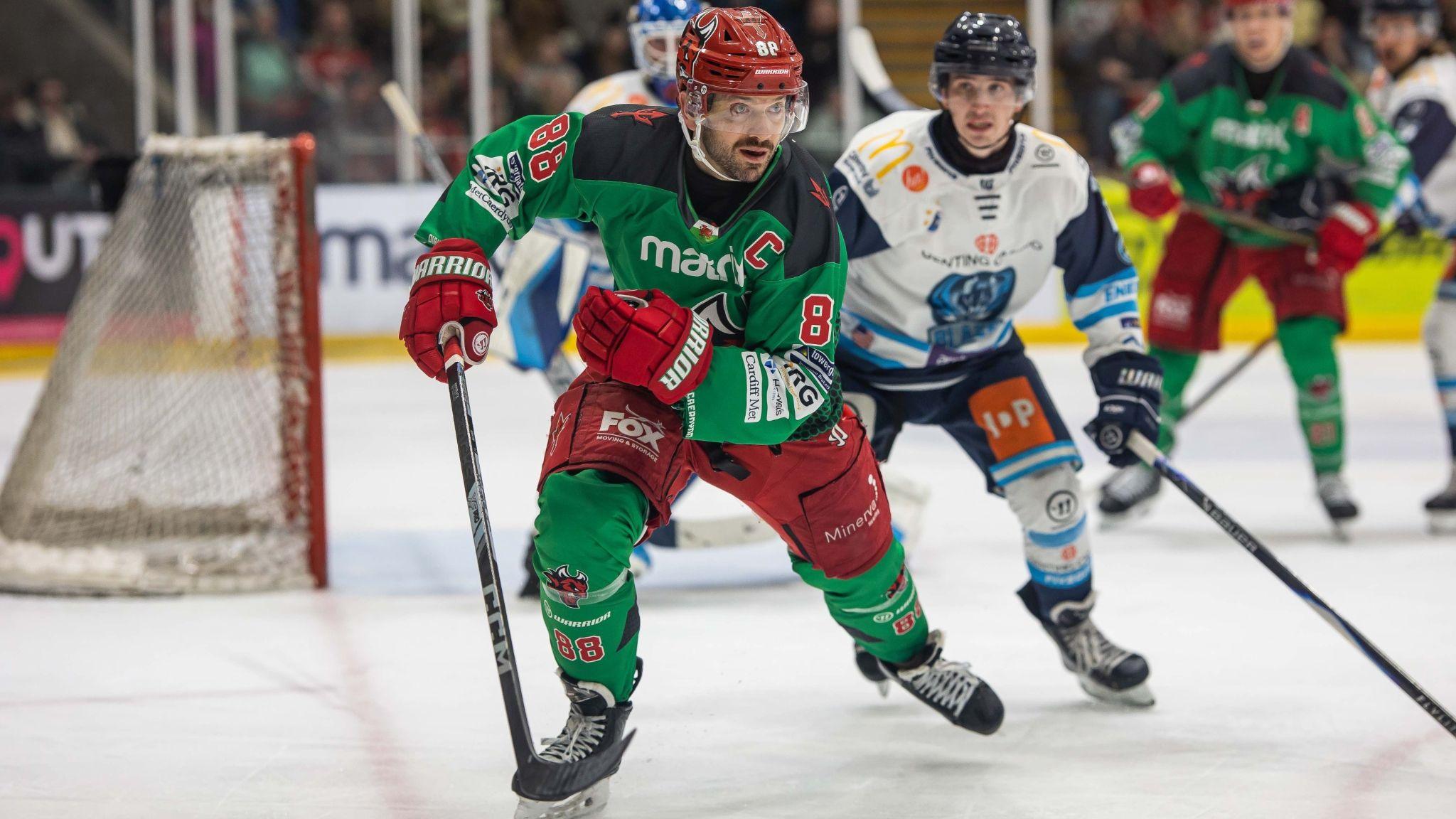 Joey Martin skating close to the Coventry net