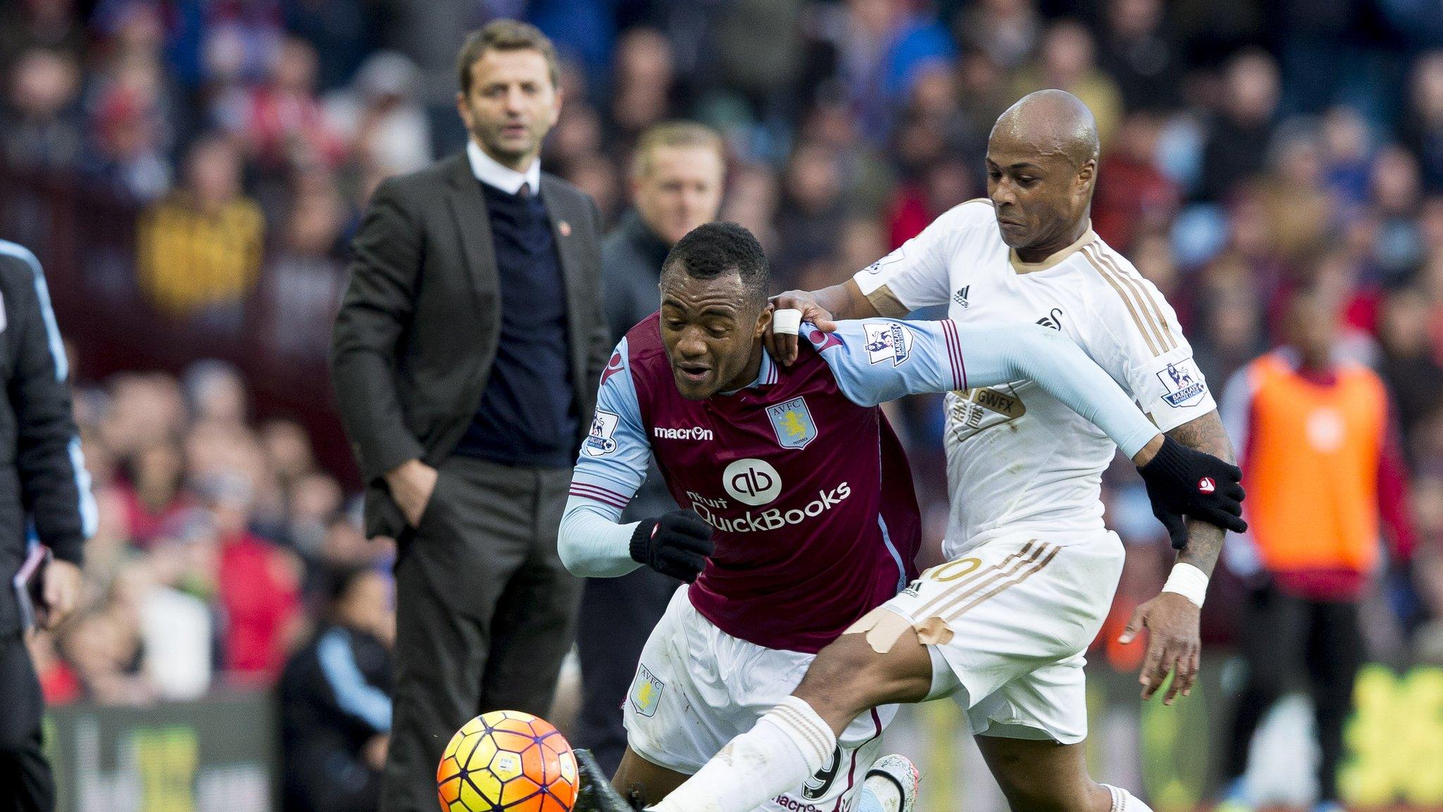 Jordan and Andre Ayew tussle at the Liberty Stadium last season.