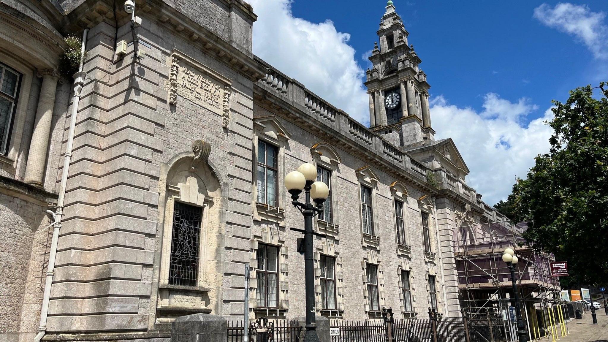 Torquay Town Hall - the headquarters of Torbay Council, an ornate grey stone building, with clock tower