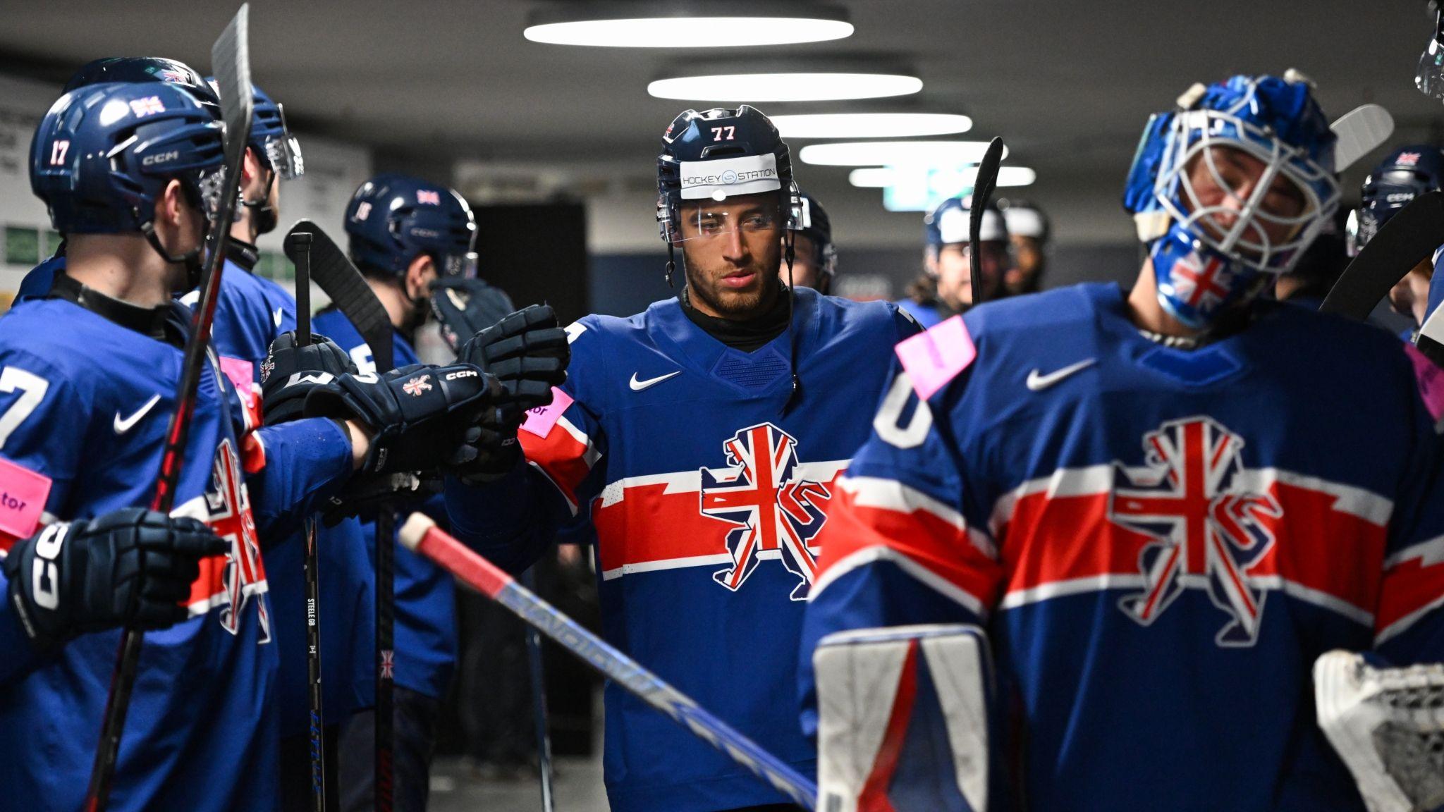 Bayley Harewood (centre) with Great Britain team-mates in the locker room