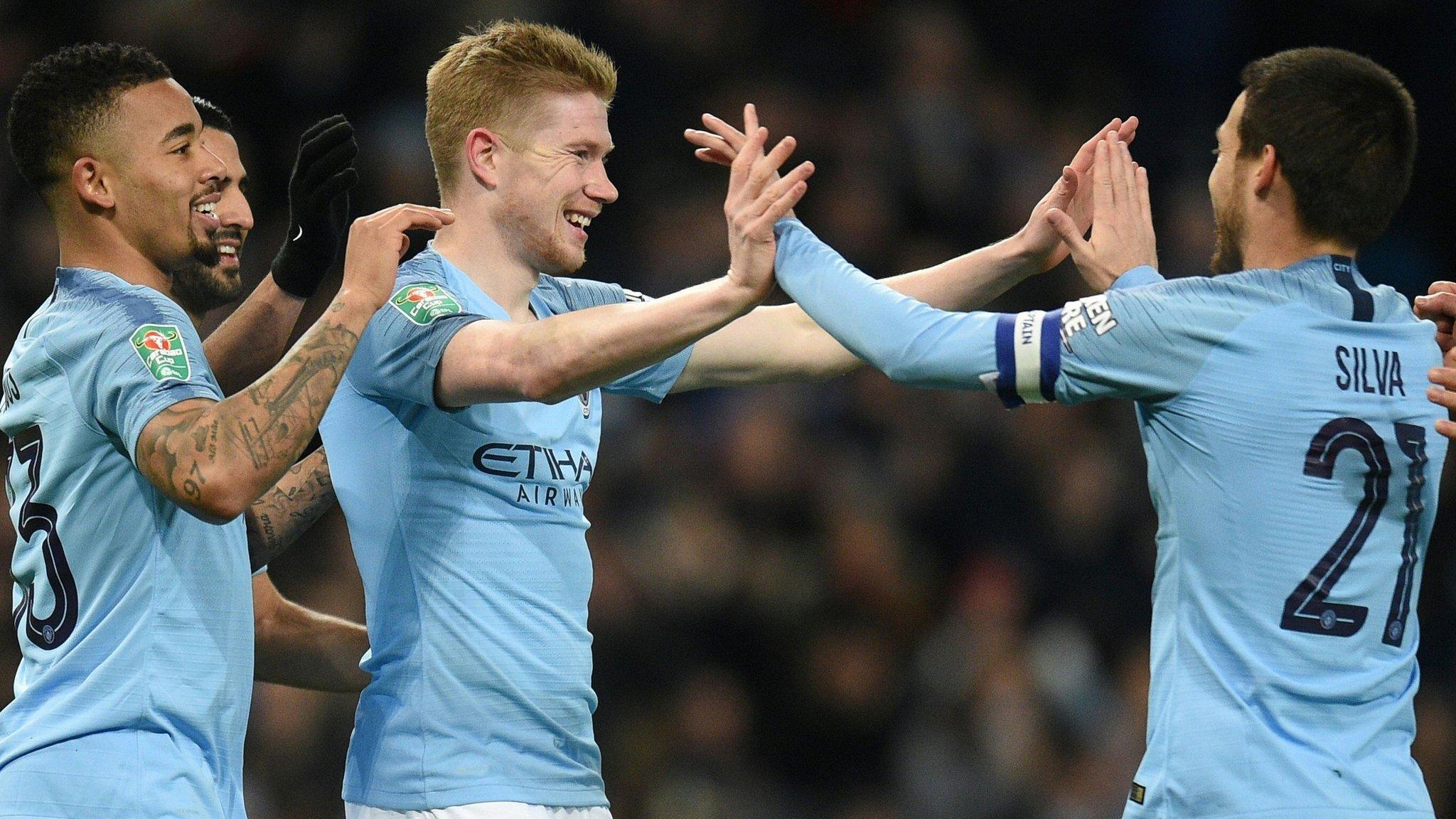 Image of Kevin de Bruyne, David Silva and Gabriel Jesus celebrating.