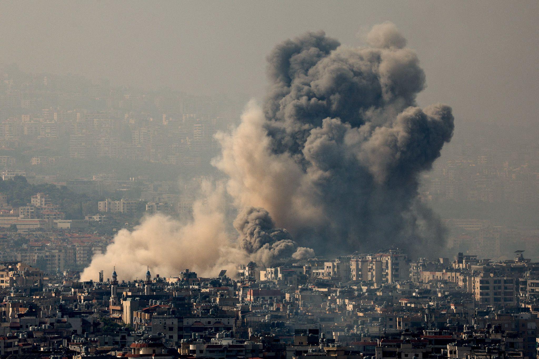 Smoke rises over Dahieh in Beirut's southern suburbs after Israeli air strikes on Satruday night.