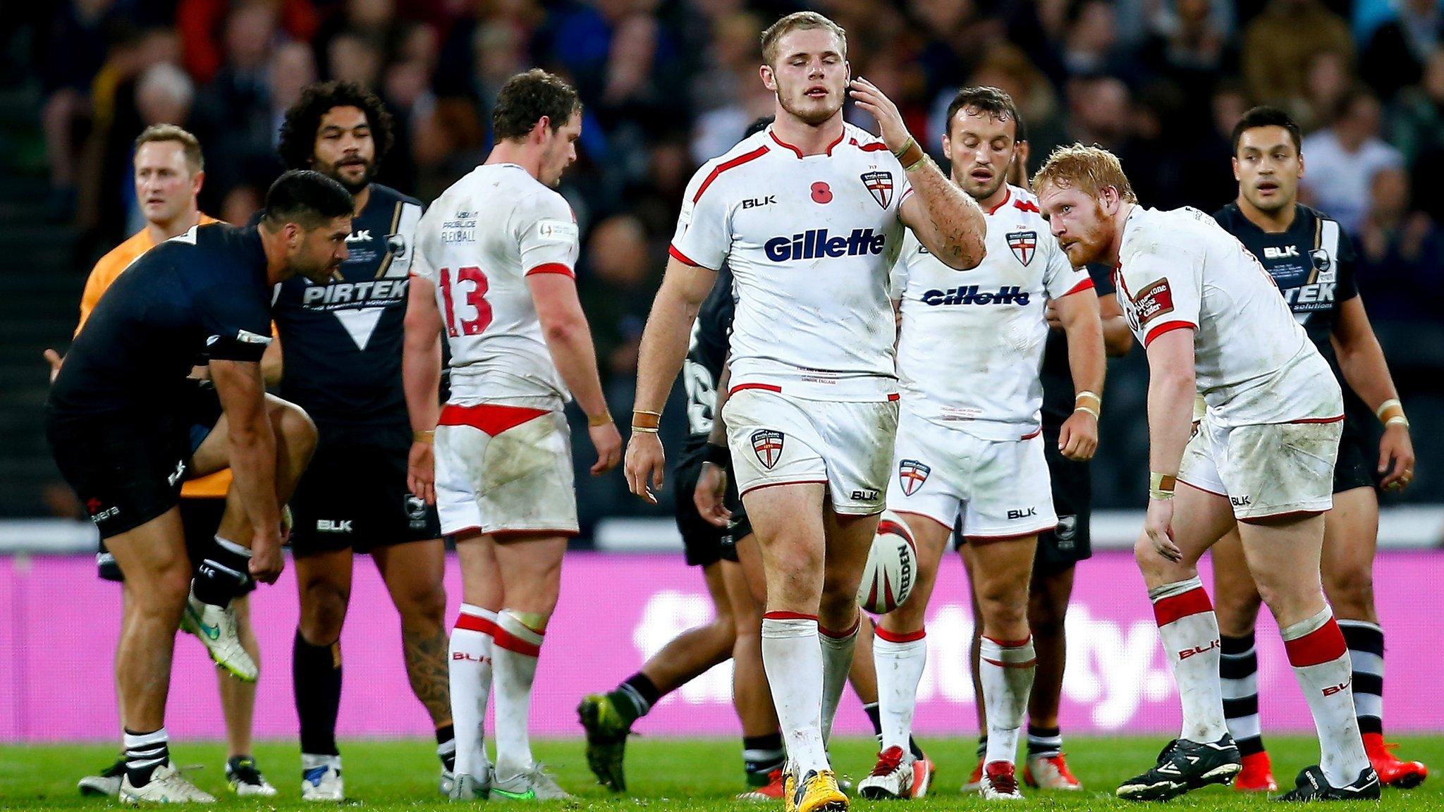 Dejected England players after defeat