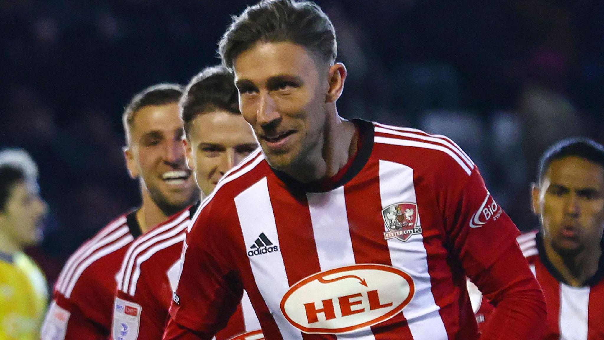 Angus MacDonald celebrates scoring his first goal since joining Exeter City 