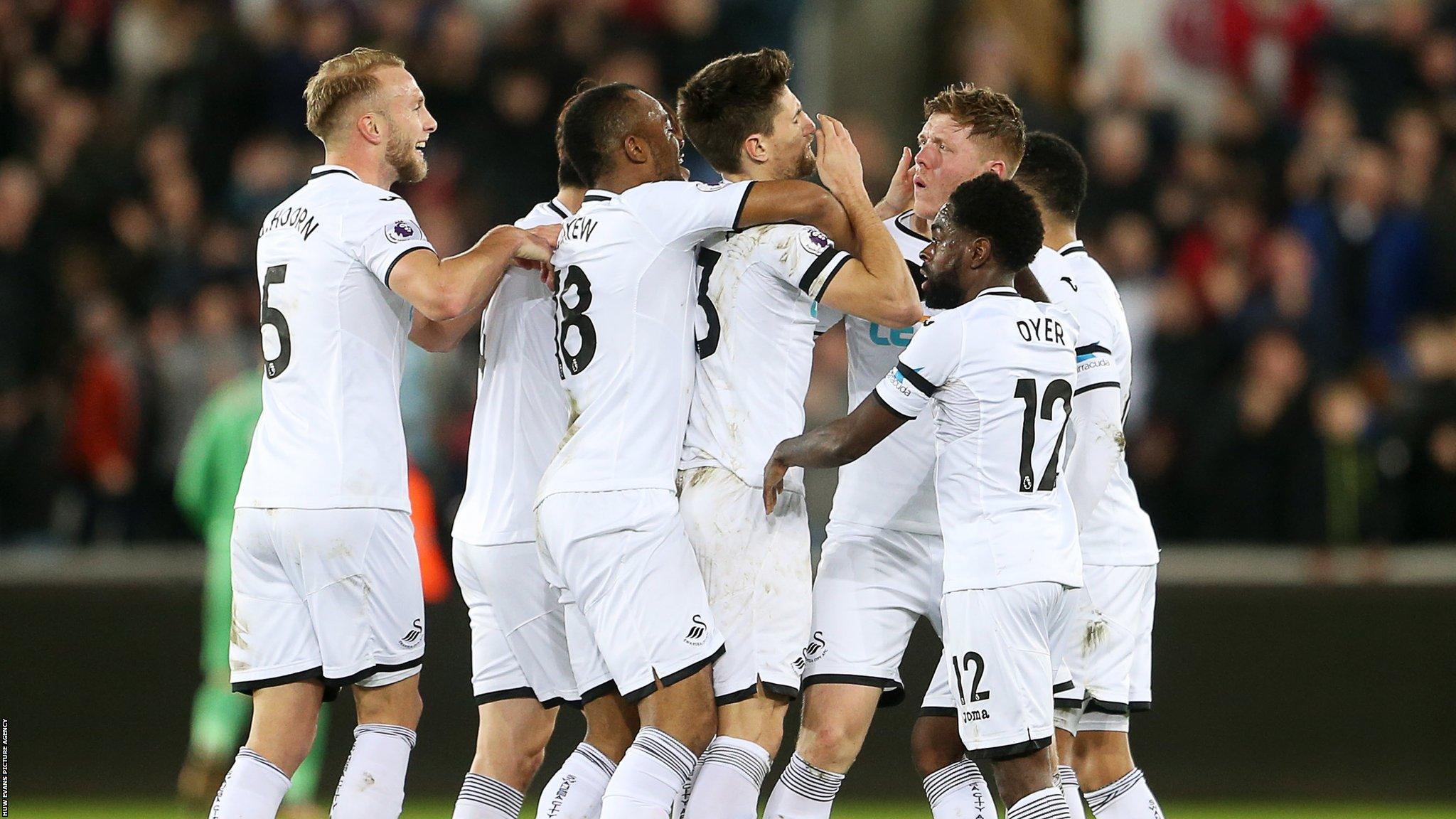 Swansea team celebrate goal vs Liverpool
