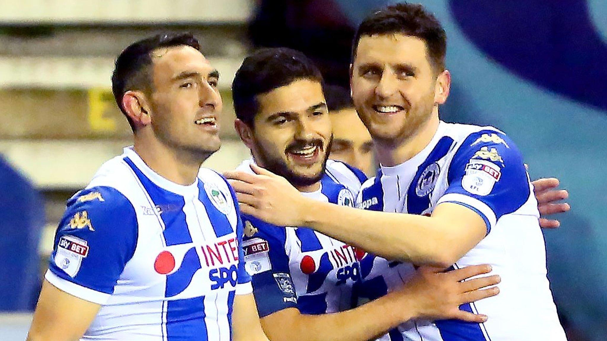 Wigan celebrate taking the lead against Bournemouth in the FA Cup