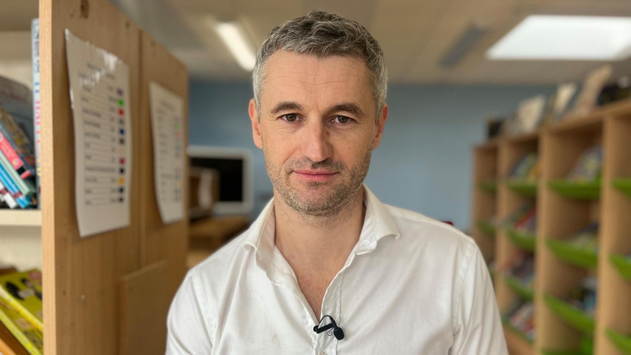 Richard Bowdler wearing a white shirt with short grey hair looking directly at the camera.