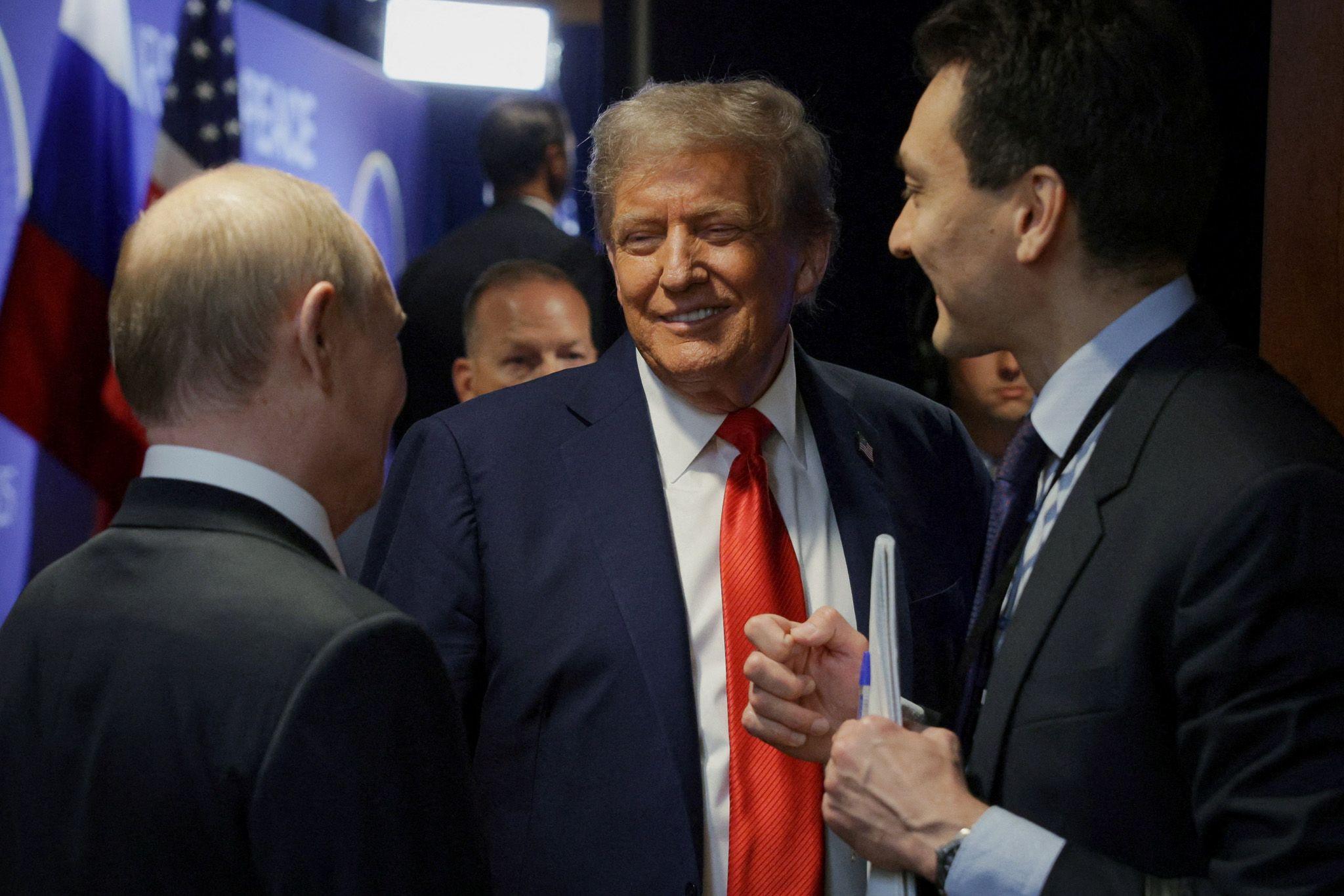 Putin and Trump share a joke. The atmosphere between the two appeared convivial throughout. 