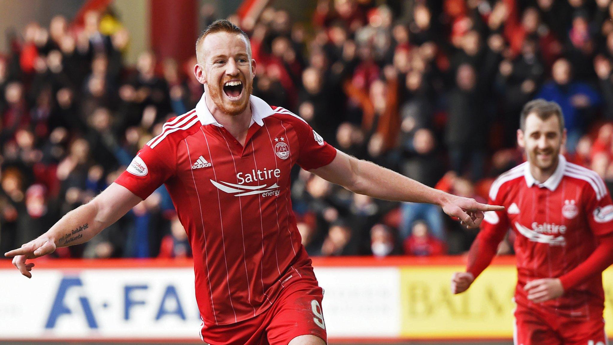 Adam Rooney celebrates his winning goal