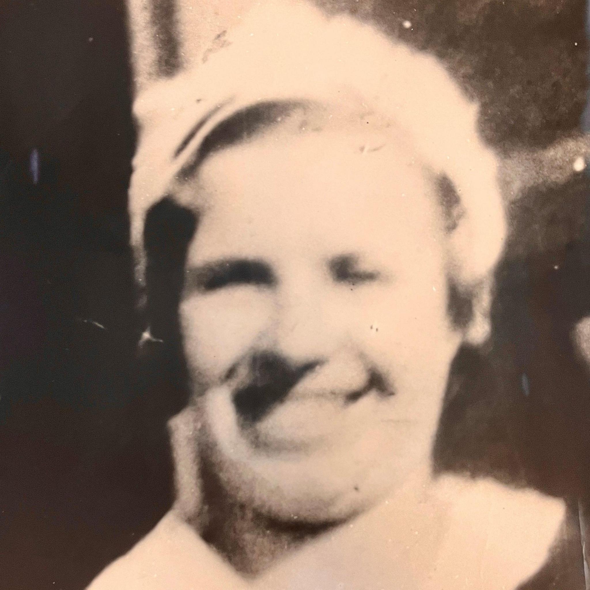 Black-and-white picture of Mary Rogerson, who is wearing a white head covering.