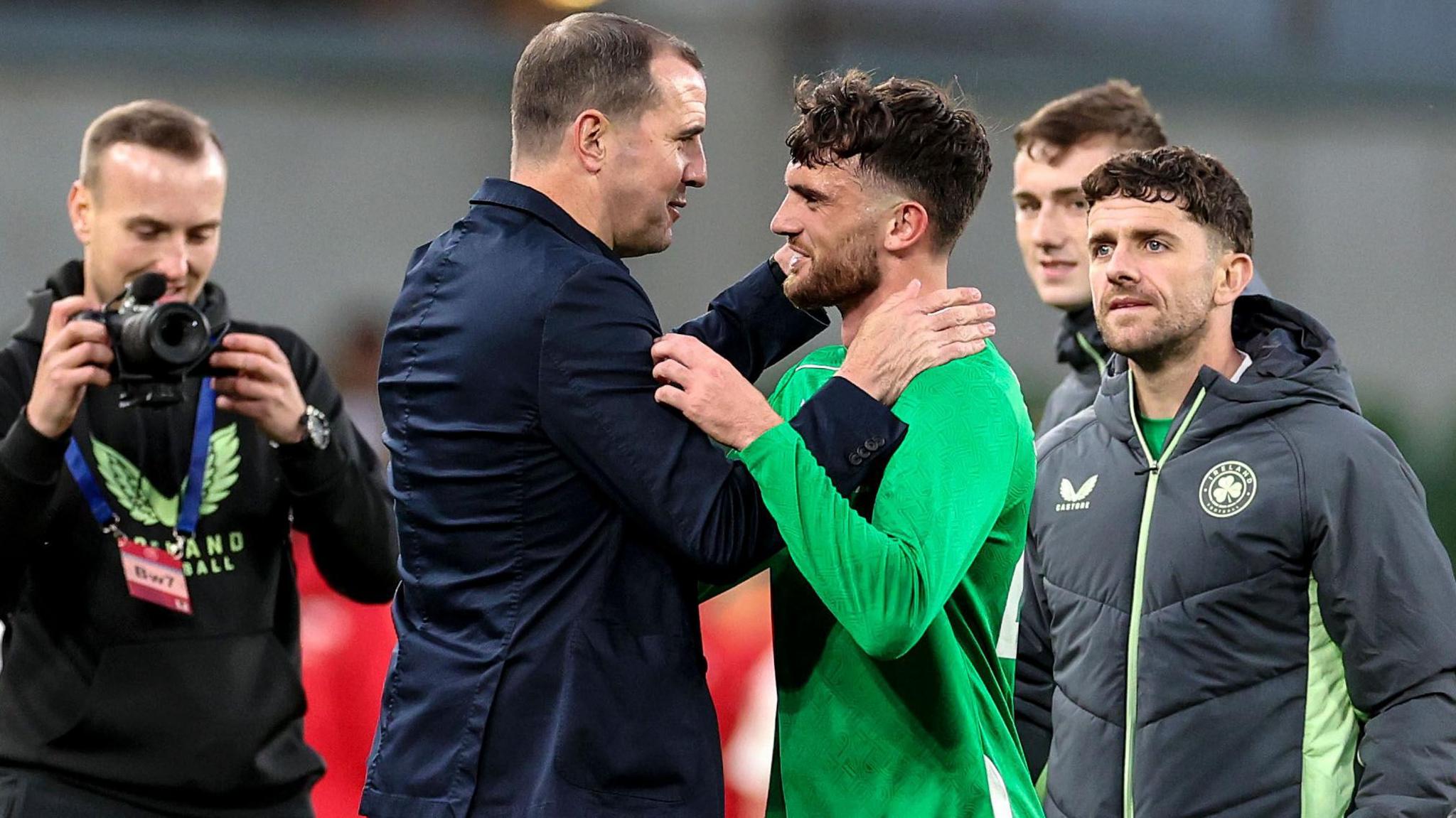 John O'Shea celebrates with Troy Parrott