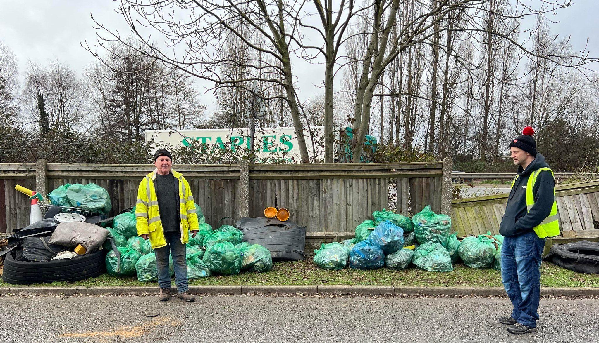 Litter picking group with bags of rubbish on the A47