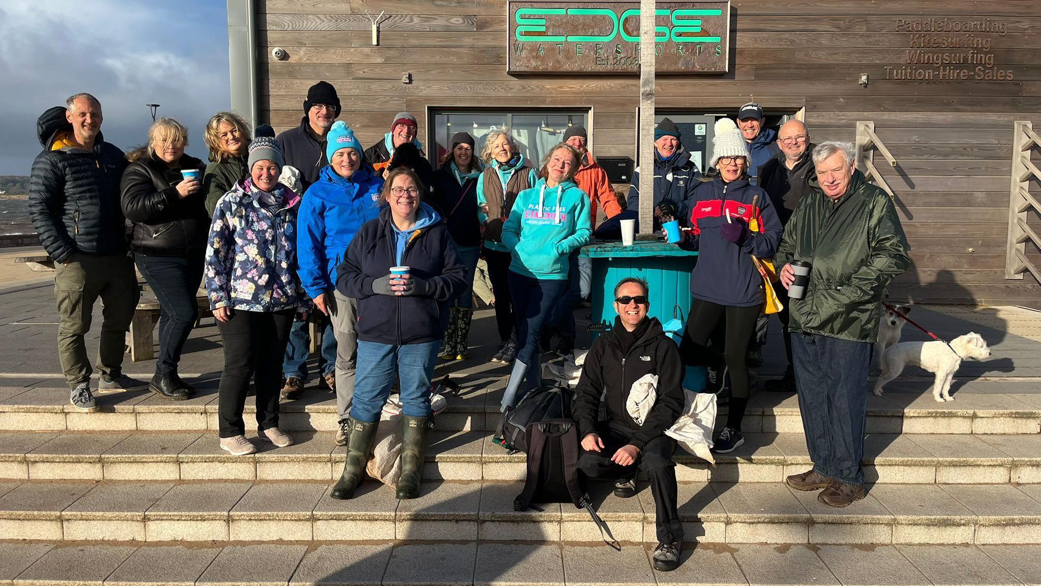 Volunteer beach cleaners at Exmouth Beach, in Devon