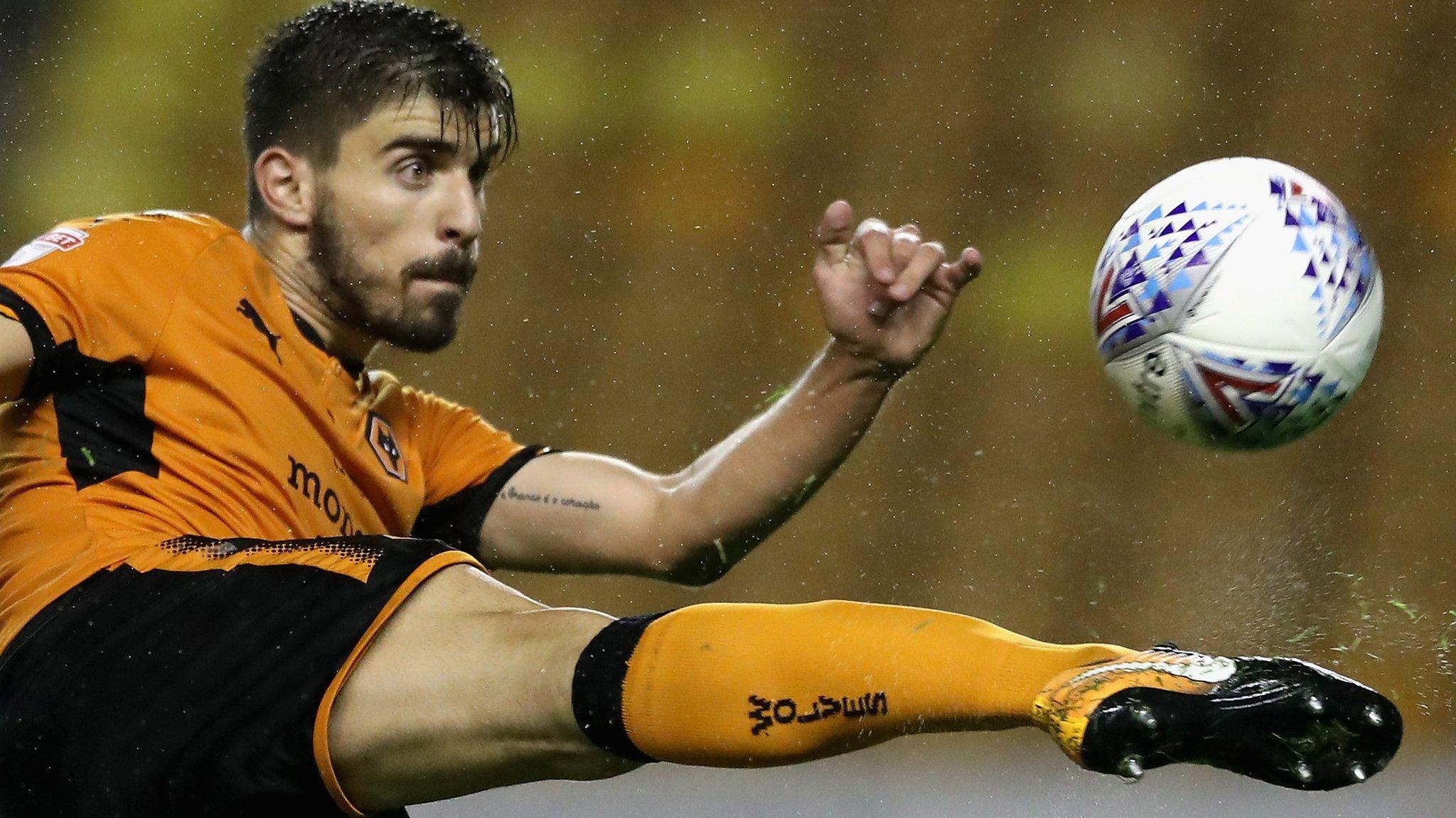 Wolves midfielder Ruben Neves volleys a ball