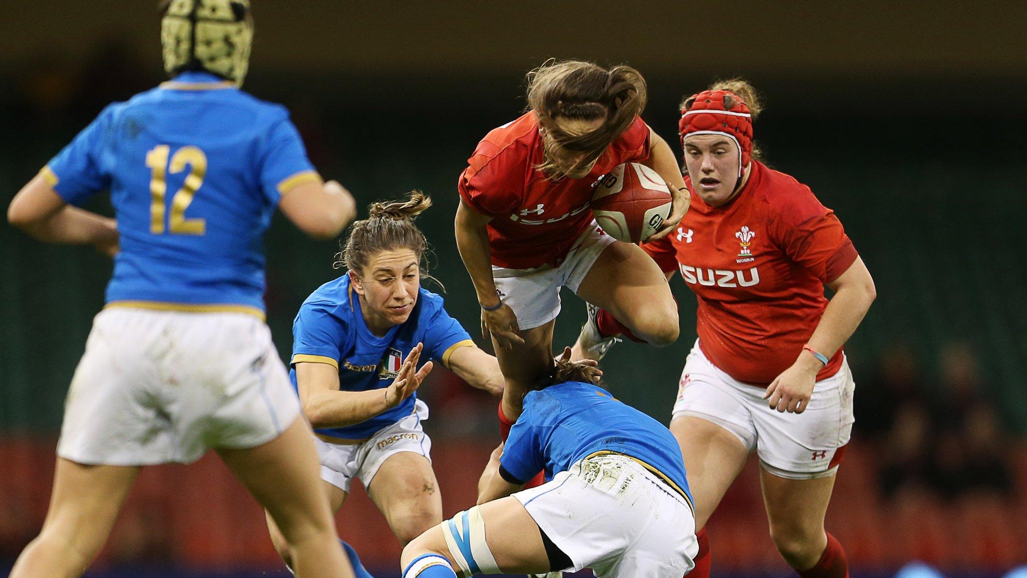 Match action, a Wales player flies over a tackle
