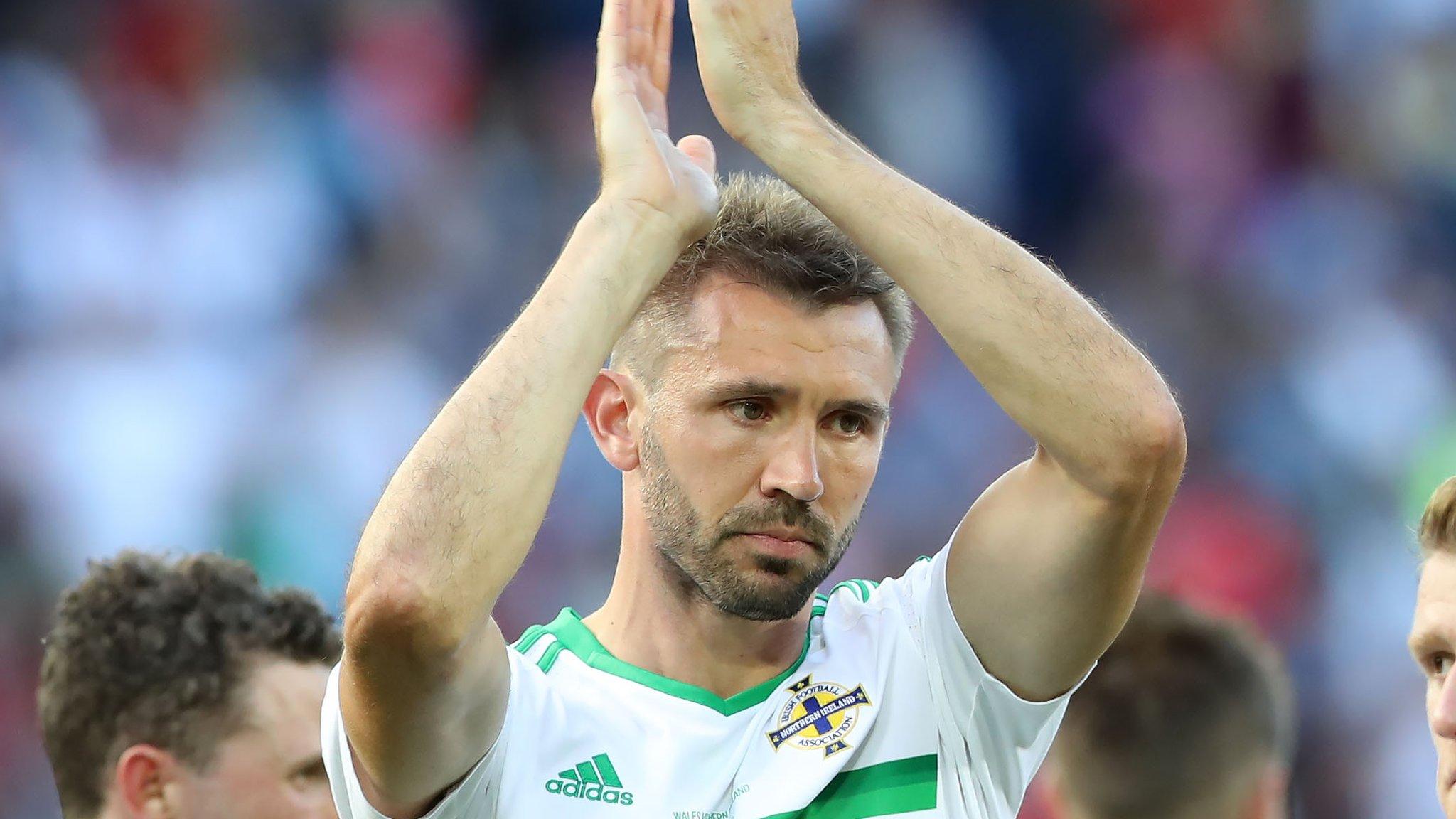 A dejected Gareth McAuley at the final whistle