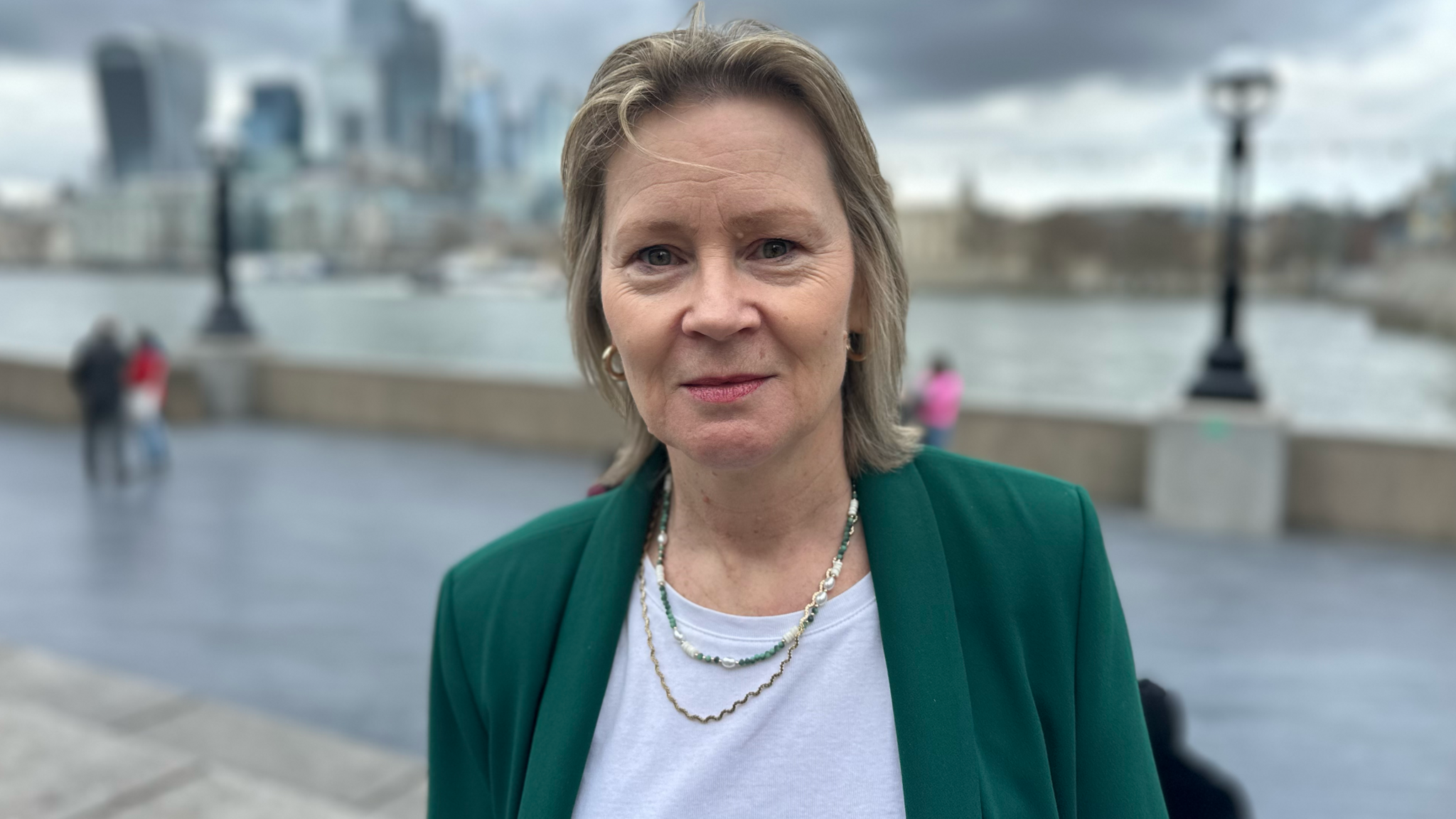 Helena Croft standing near Tower Bridge in London