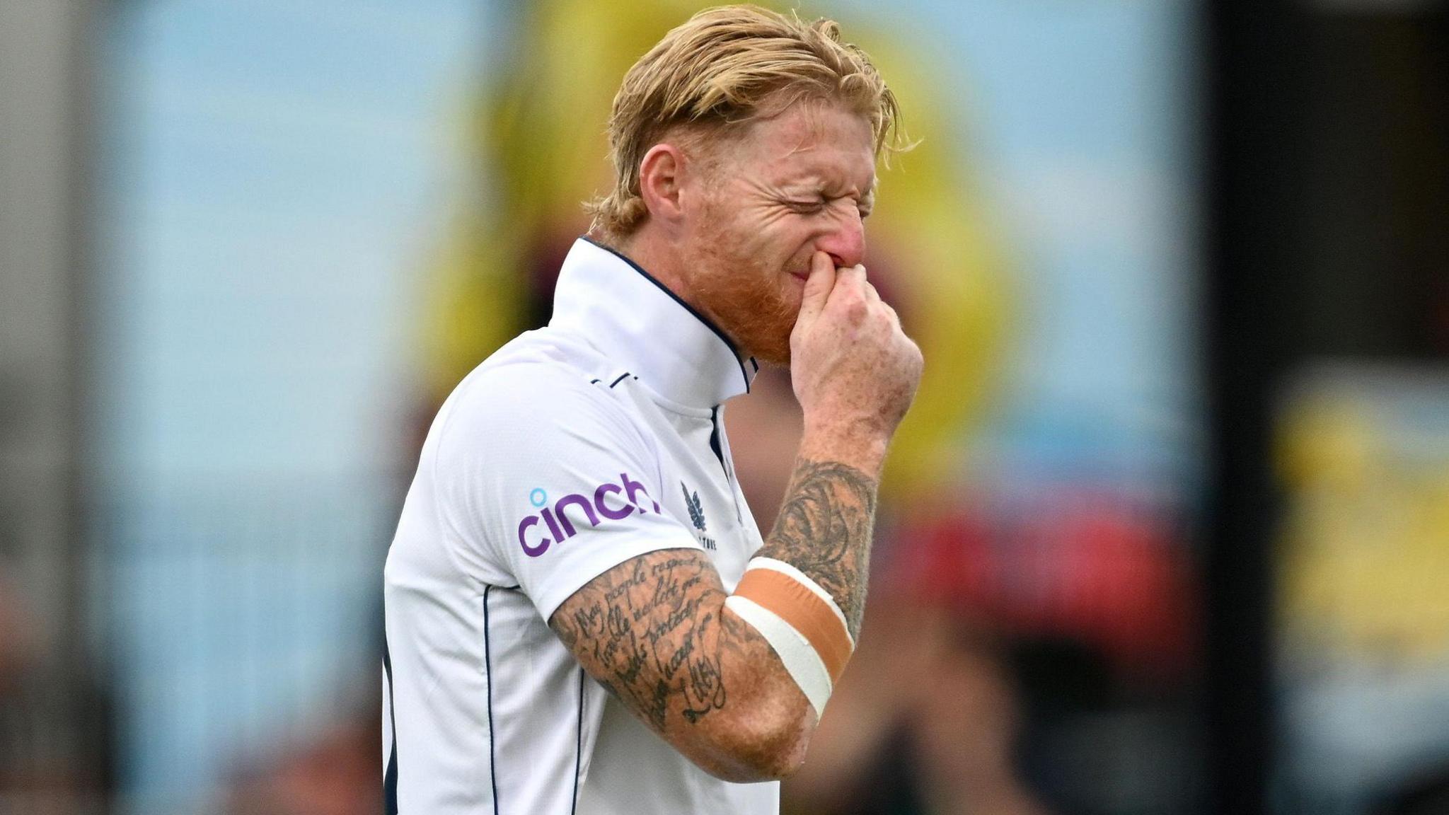 Ben Stokes grimaces because of a hamstring injury