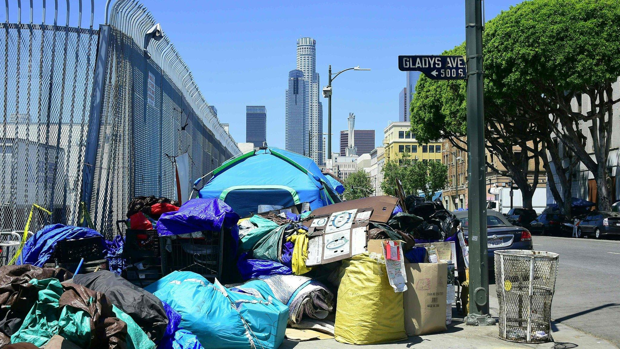 Tents housing the homeless and their belongings crowd a street corner in Los Angeles, California on April 20, 2017