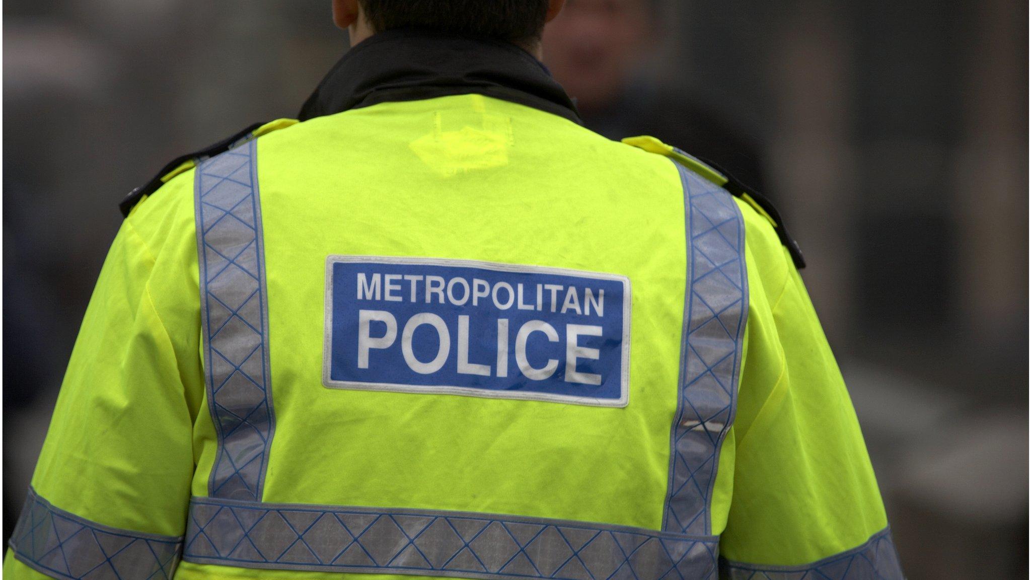 Back of a Metropolitan Police officer in uniform