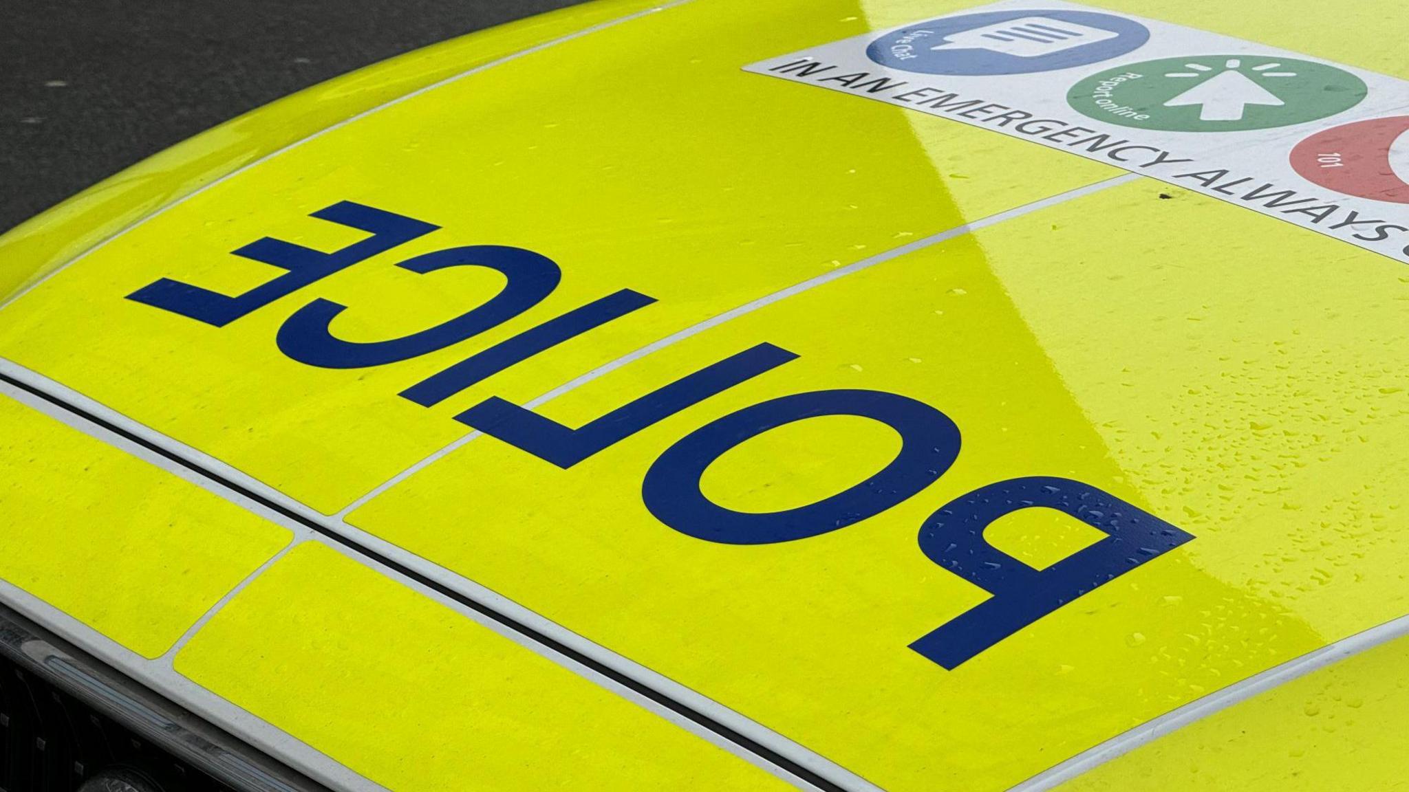 Staffordshire police car with yellow bonnet and 'police' written in blue. 