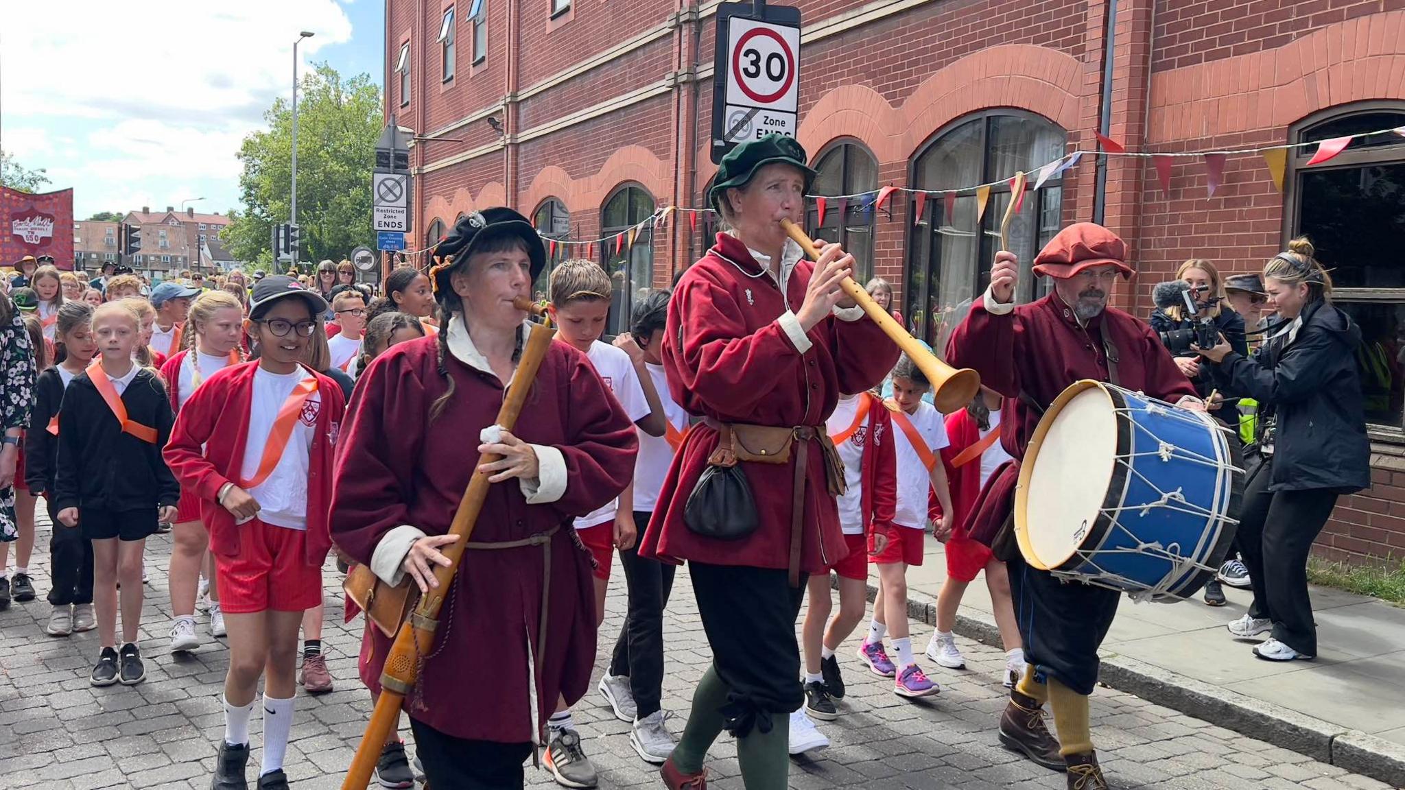 Children and pipers parade through Ipswich