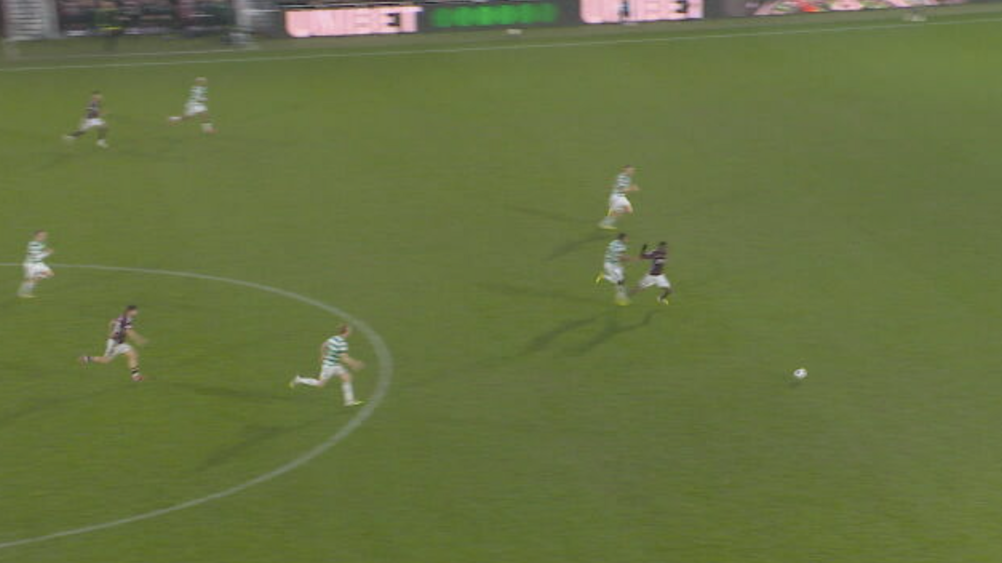 Austron Trusty brings down Hearts striker Pierre Landry Kabore as he runs in behind the Hearts defence