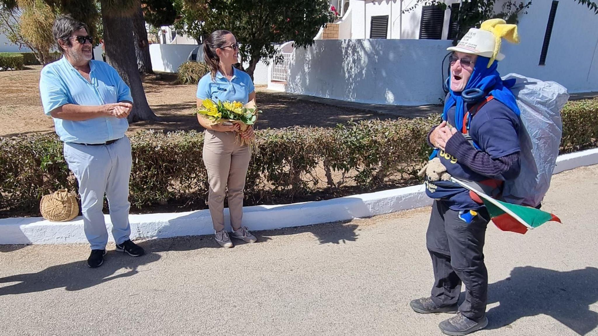 Ian West (right) at a celebration to mark the end of his walking challenge