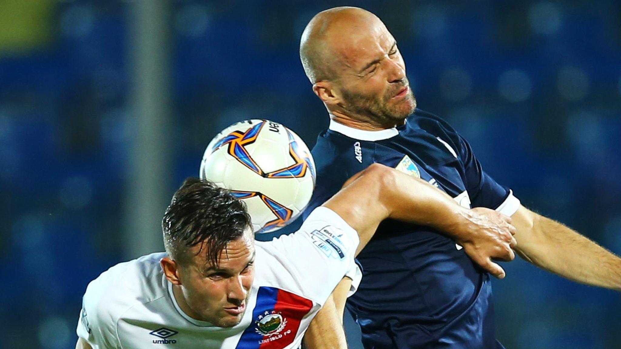 Linfield's Andrew Waterworth battles with La Fiorita's Samuele Olivi in San Marino