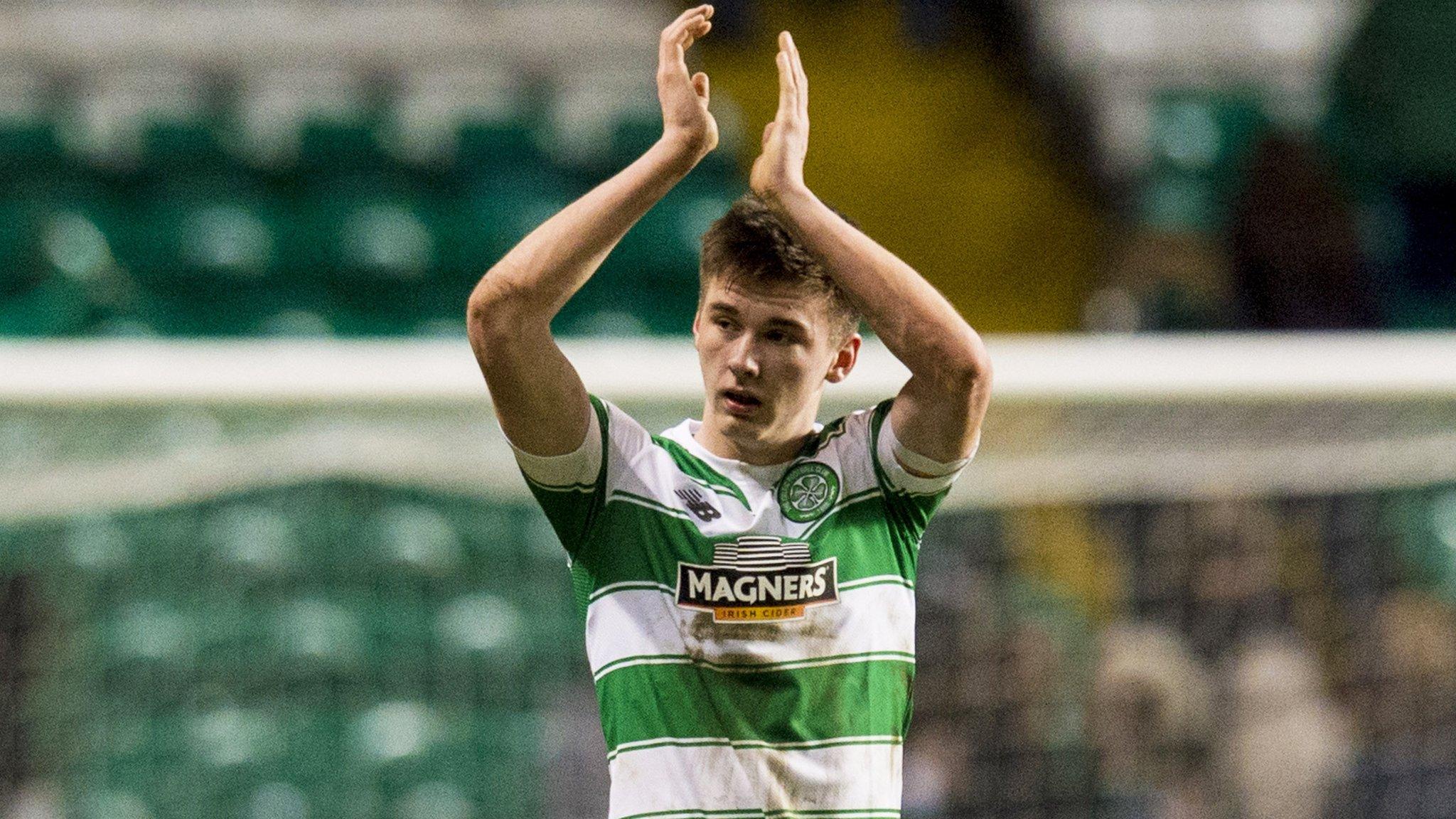 Kieran Tierney applauds the Celtic fans