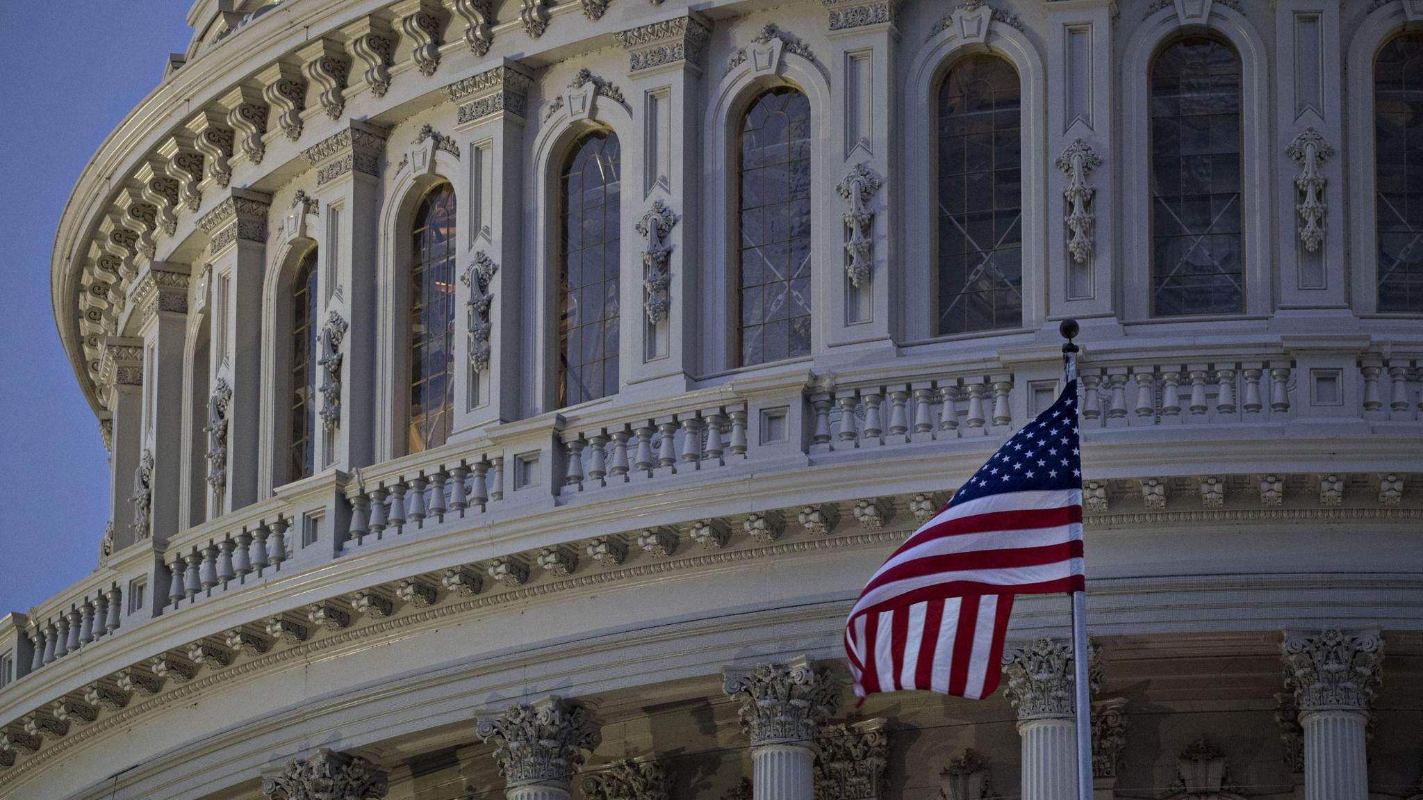 The American flag flies outside the US Capitol building in Washington DC