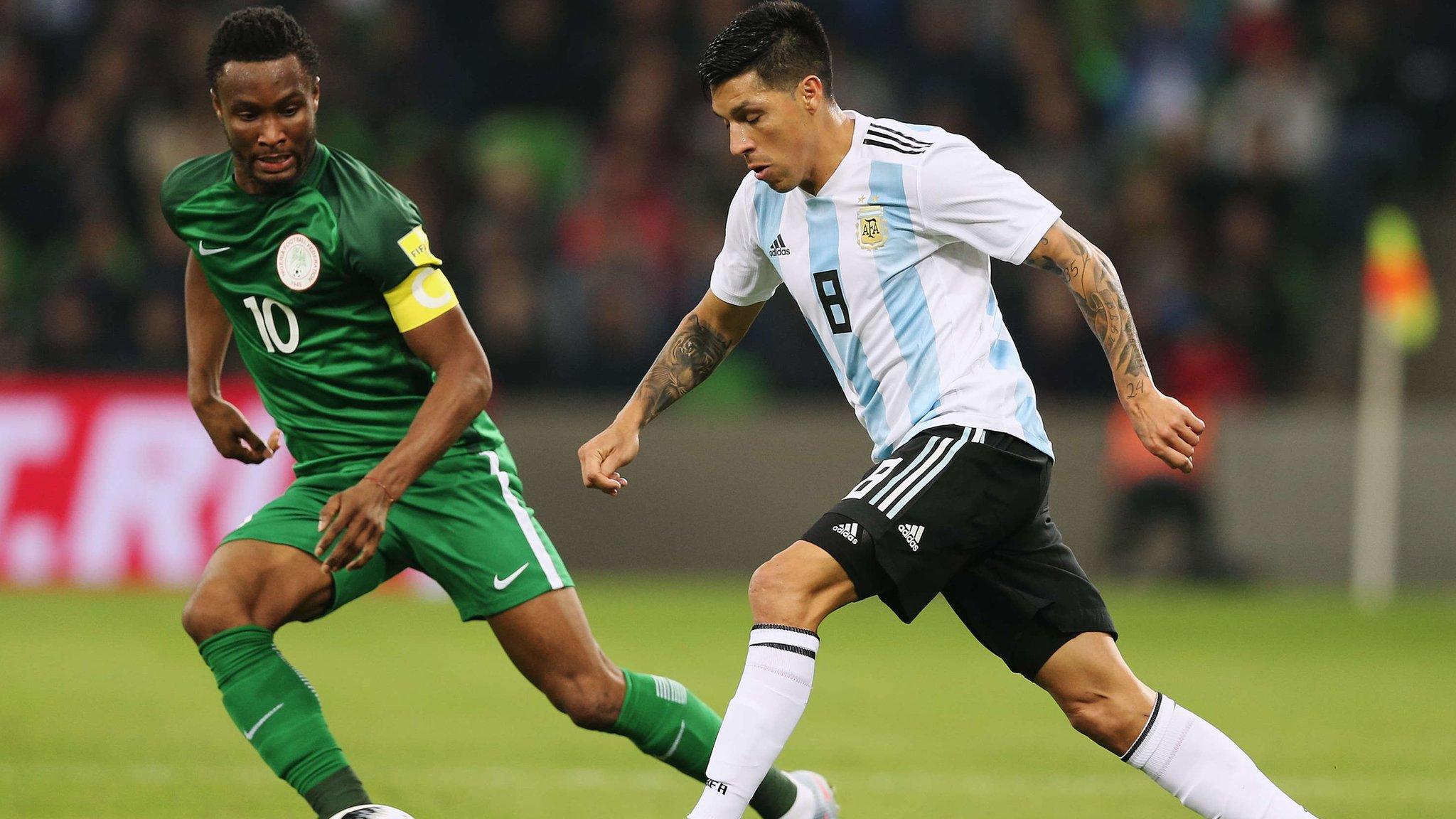 Nigeria captain John Mikel Obi (left) in action against Argentina