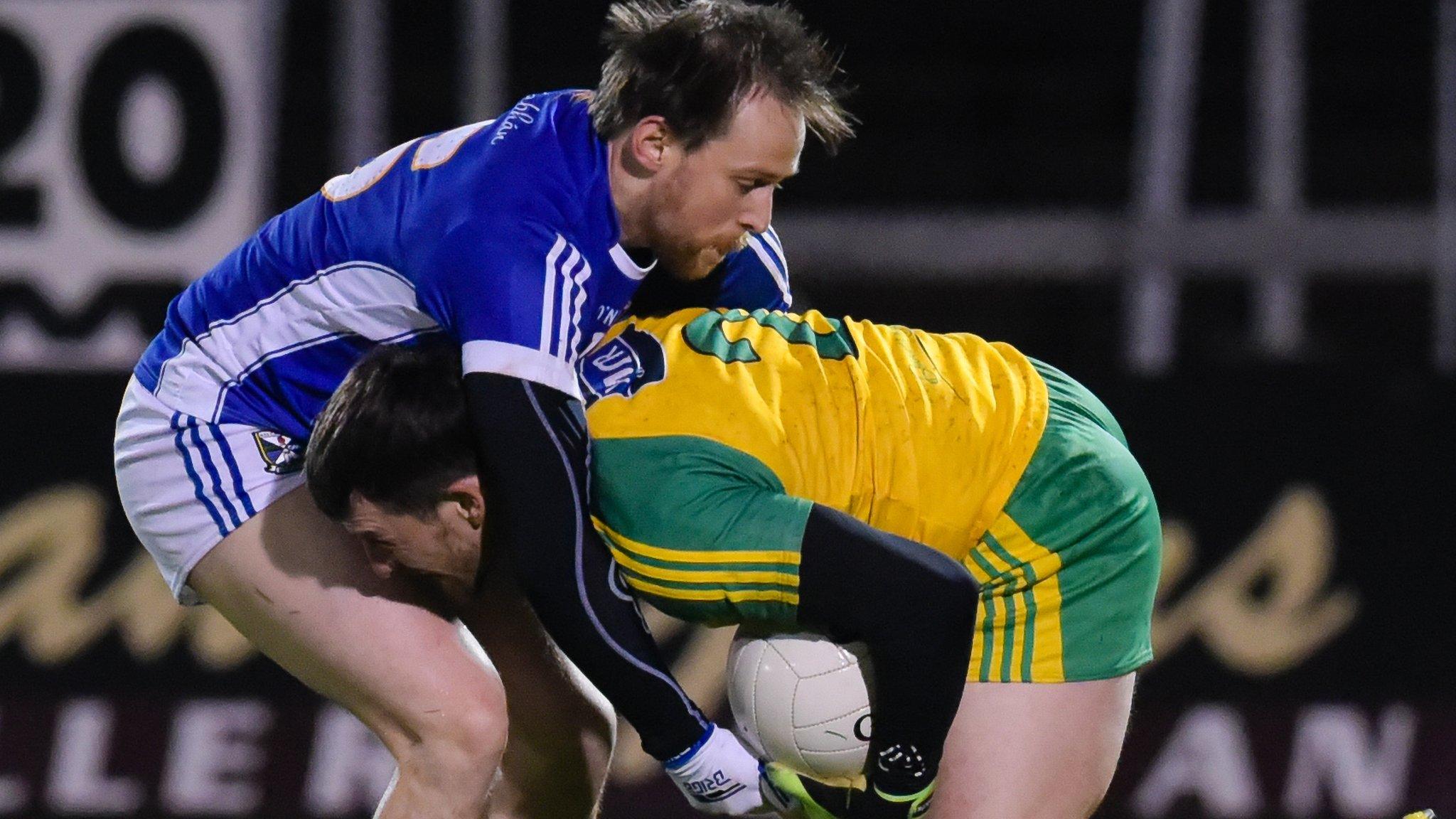 Cavan forward Seanie Johnston tackles Donegal's Paddy McGrath