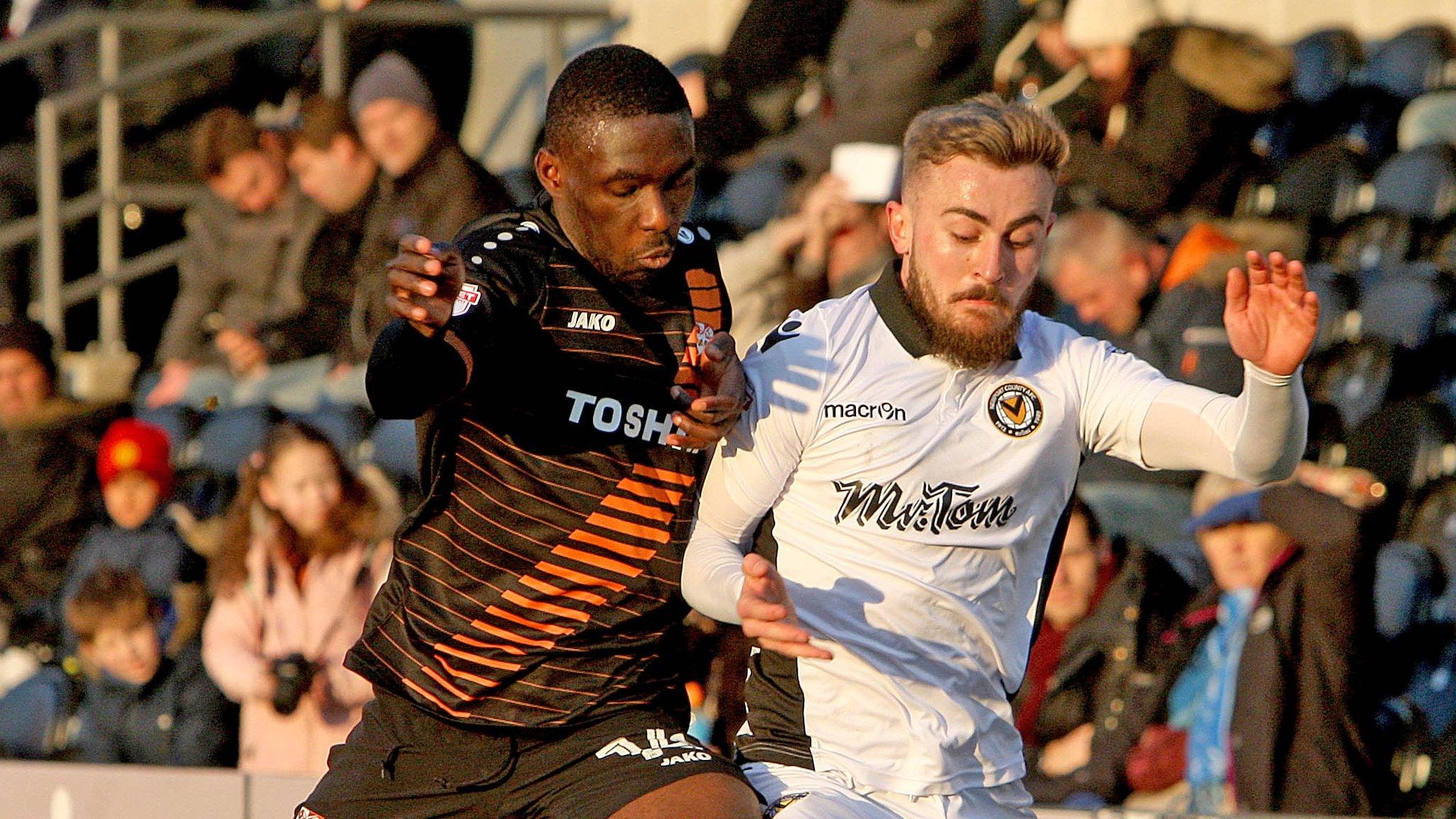 Dan Butler (right) on the attack for Newport County against Barnet