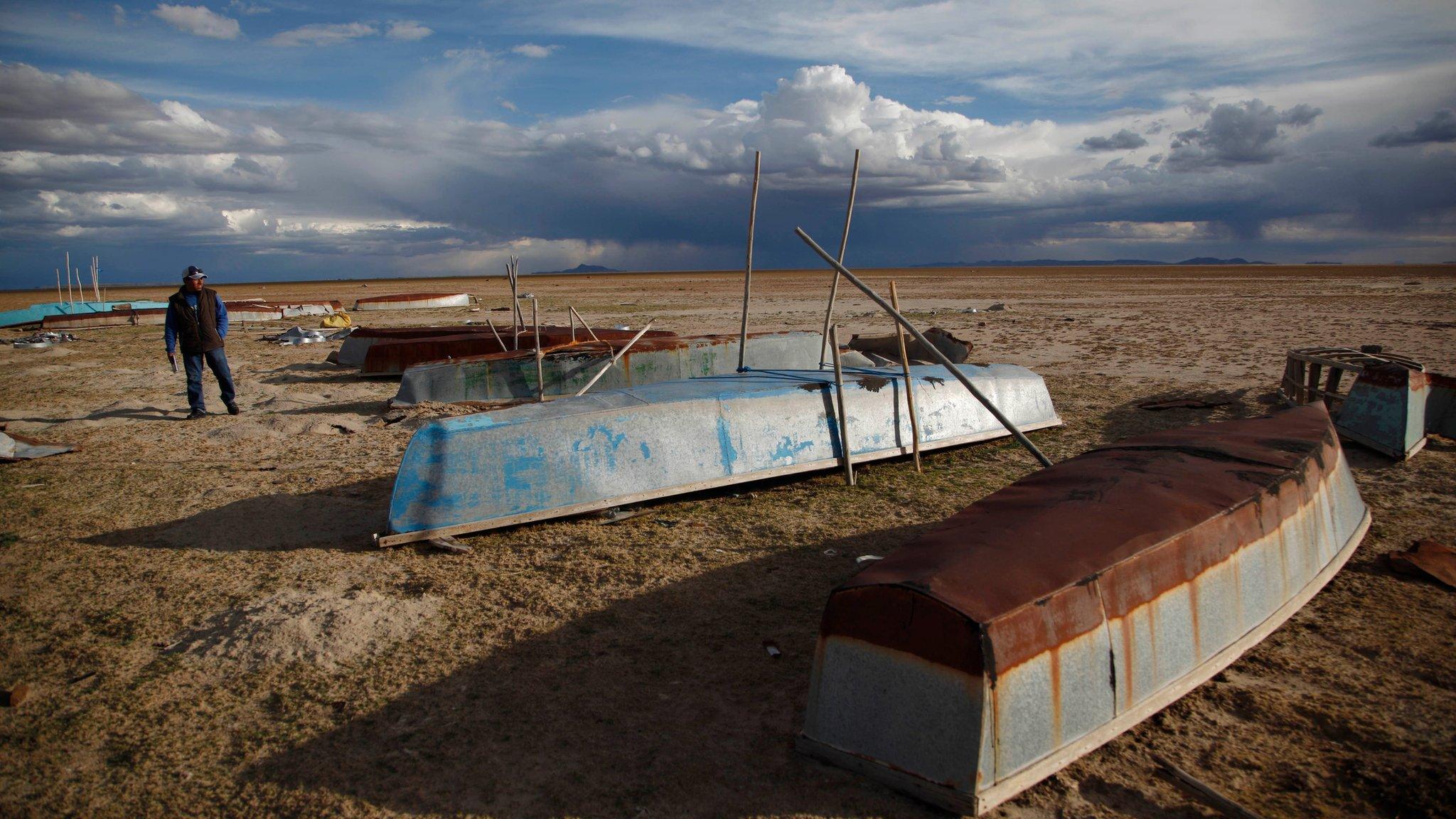 Abandoned boats in dried out lake