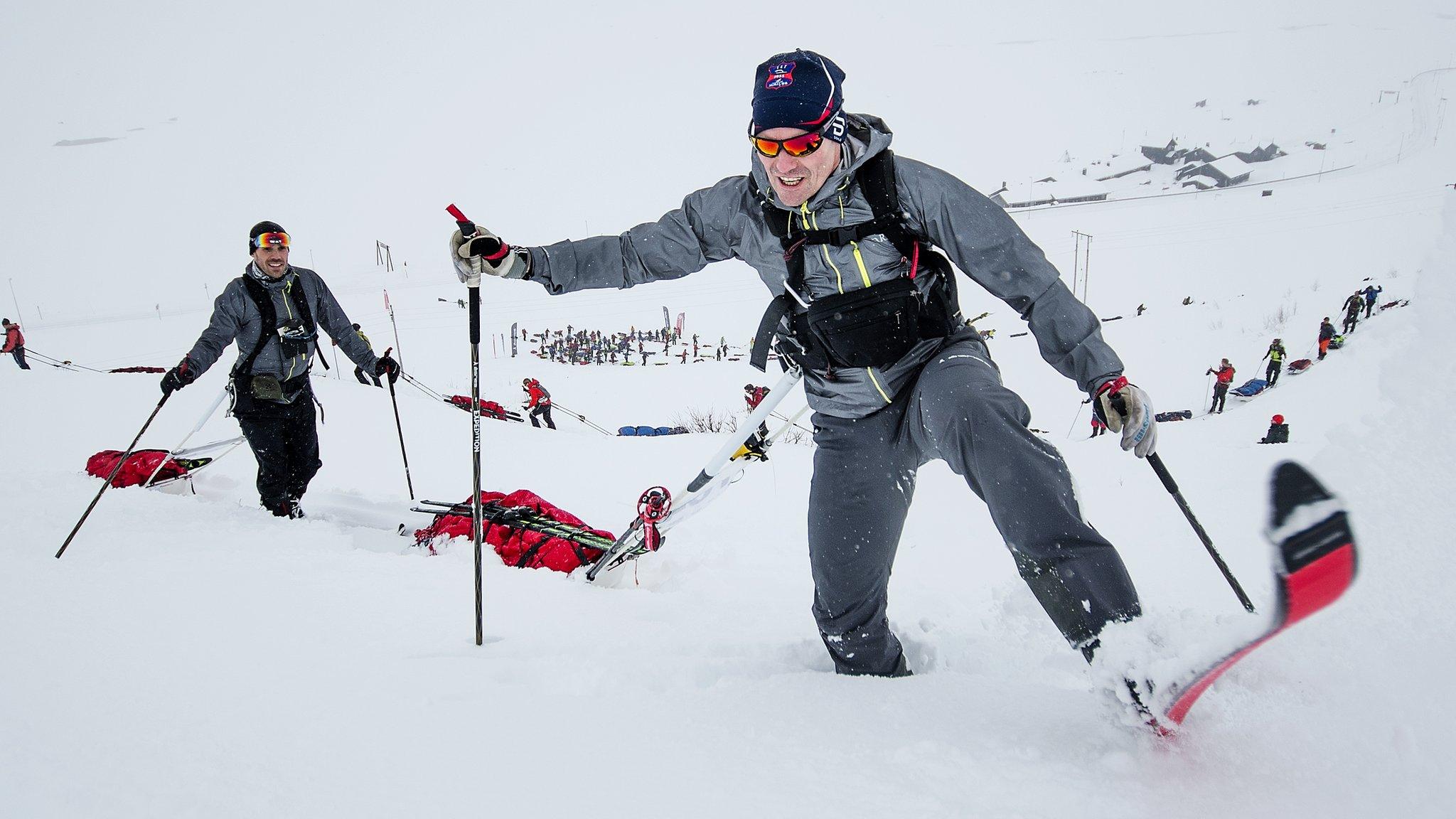 Oyvind Lillehagen and Halvor Wang of Team Asnes-RAB fight through deep snow at Expedition Amundsen, which is known as the world's hardest expedition race.