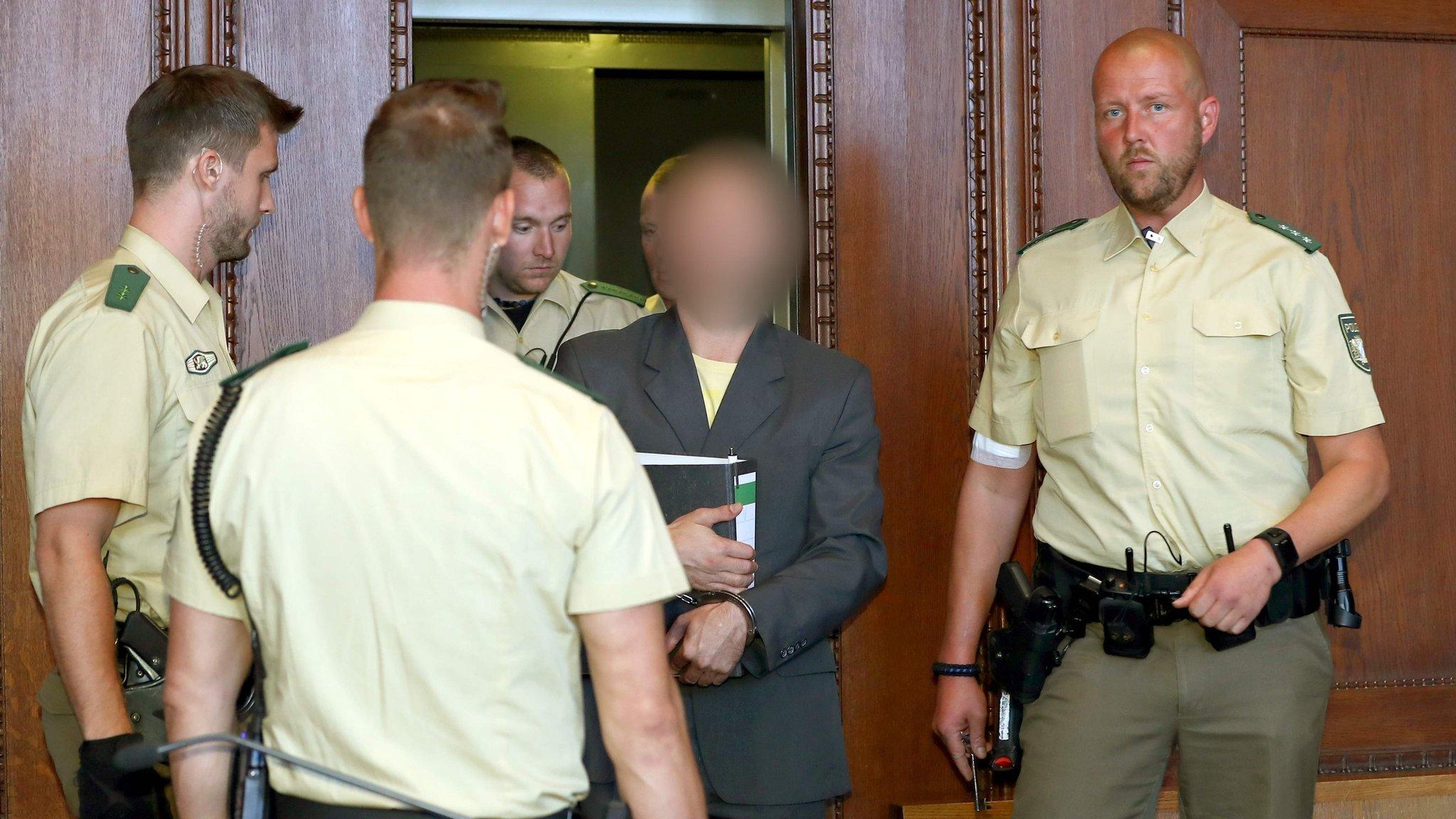 Wolfgang P, alleged member of the far-right Reichsbürger movement, arrives at his trial at the Nuremberg-Fuerth Court in Nuremberg, southern Germany on 29 August 2017