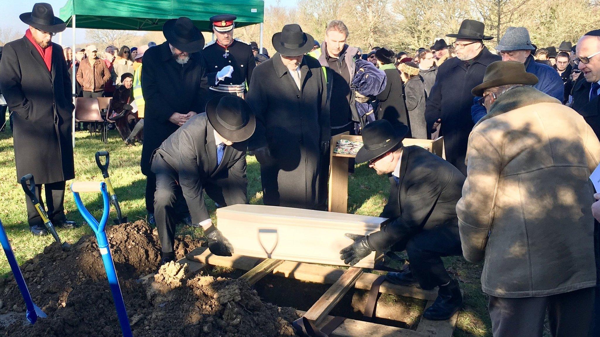 Remains of victims being buried