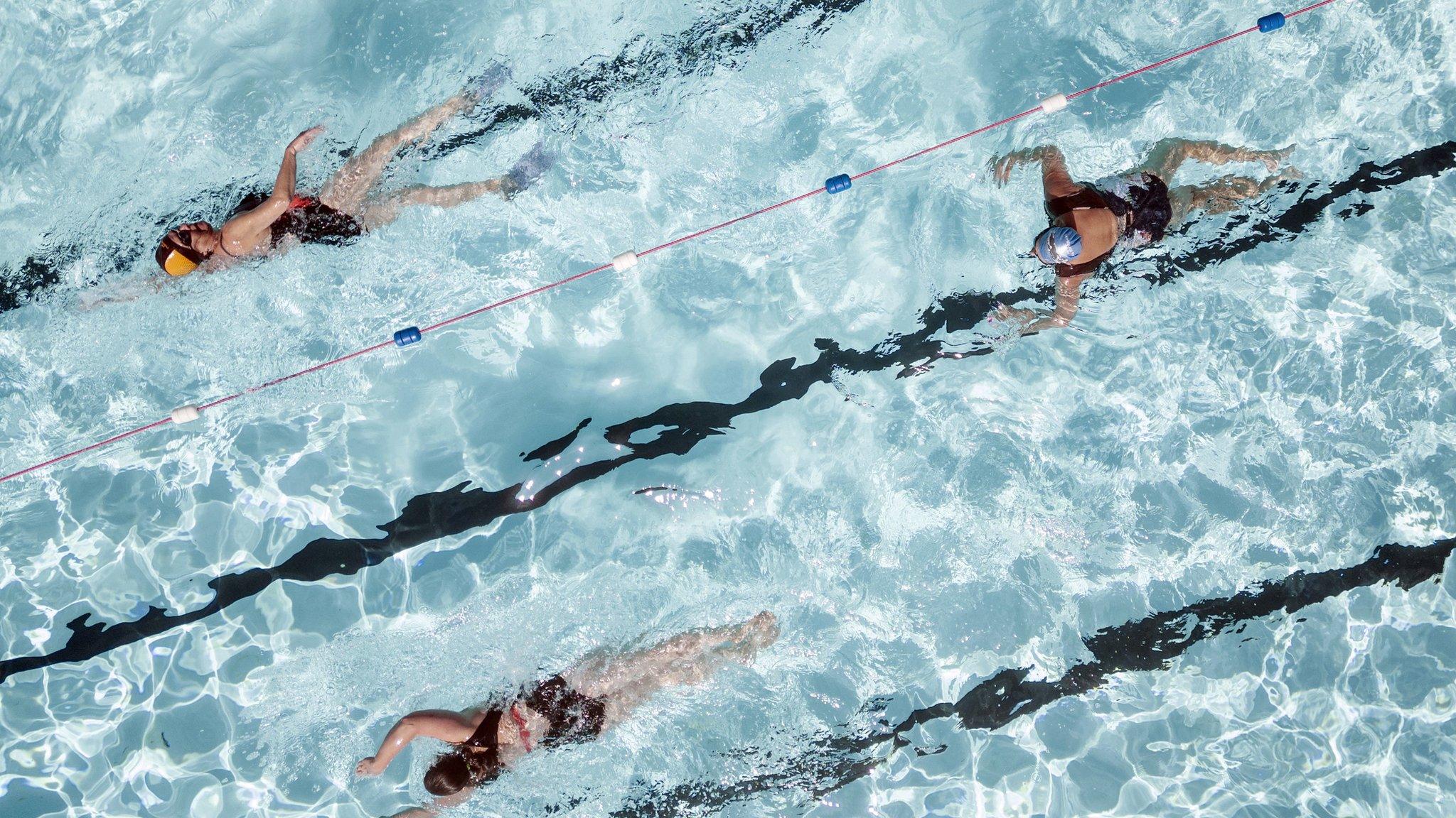 Swimmers swimming lengths in a swimming pool